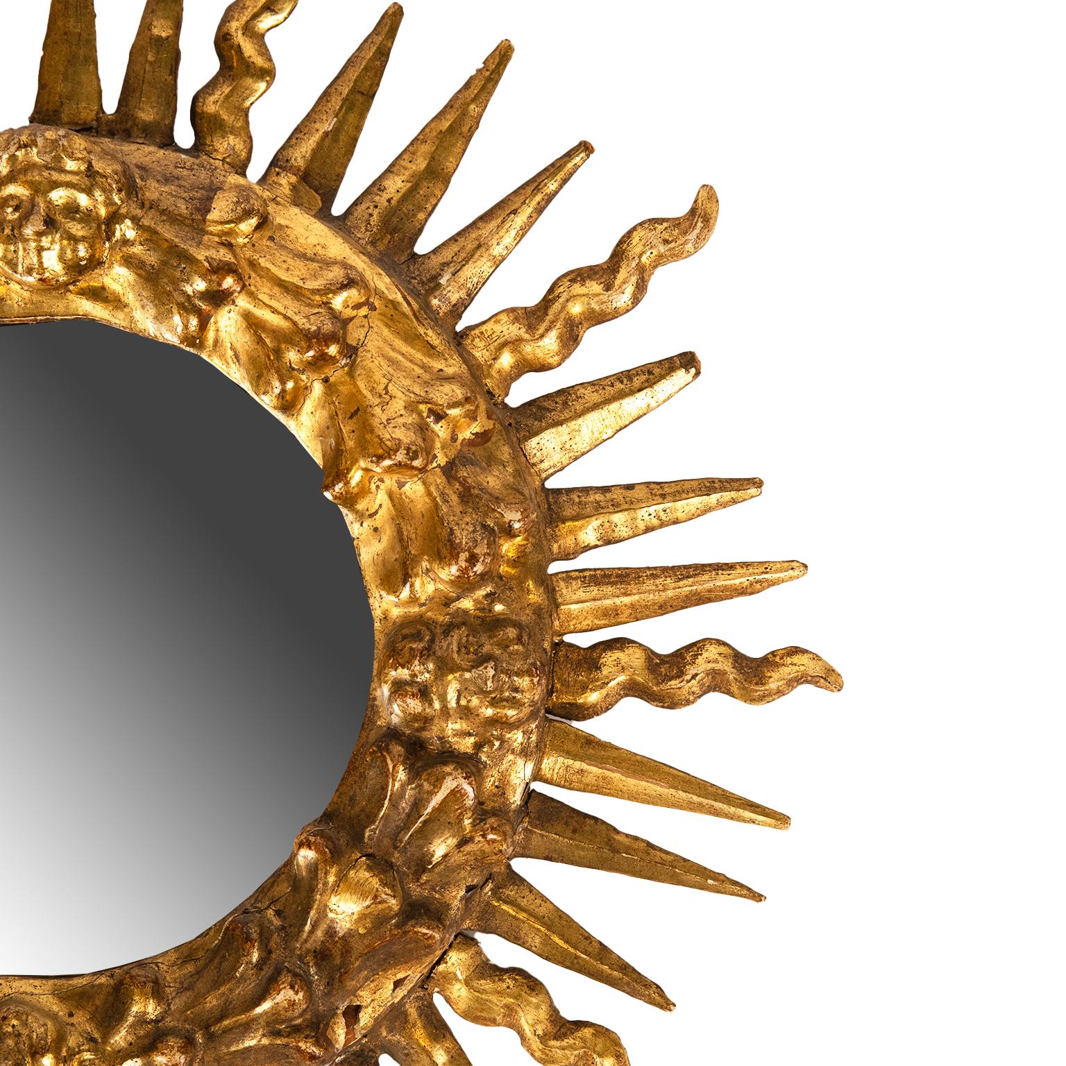 A classic gilt wood and gesso diminutive sunburst mirror in excellent antique condition with replacement mirror.
Great antique mirror that can fit in any decor!