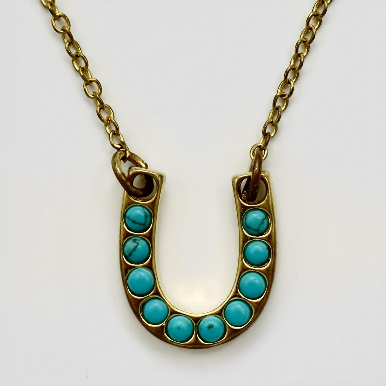 Antique gold gilt metal and turquoise horseshoe pendant and chain. Measuring length 47.5 cm / 18.7 inches, and the pendant measures length 2.1 cm / .8 inch by 1.75 cm / .68 inch. There is wear to the gold gilt. We replaced the clasp with a new