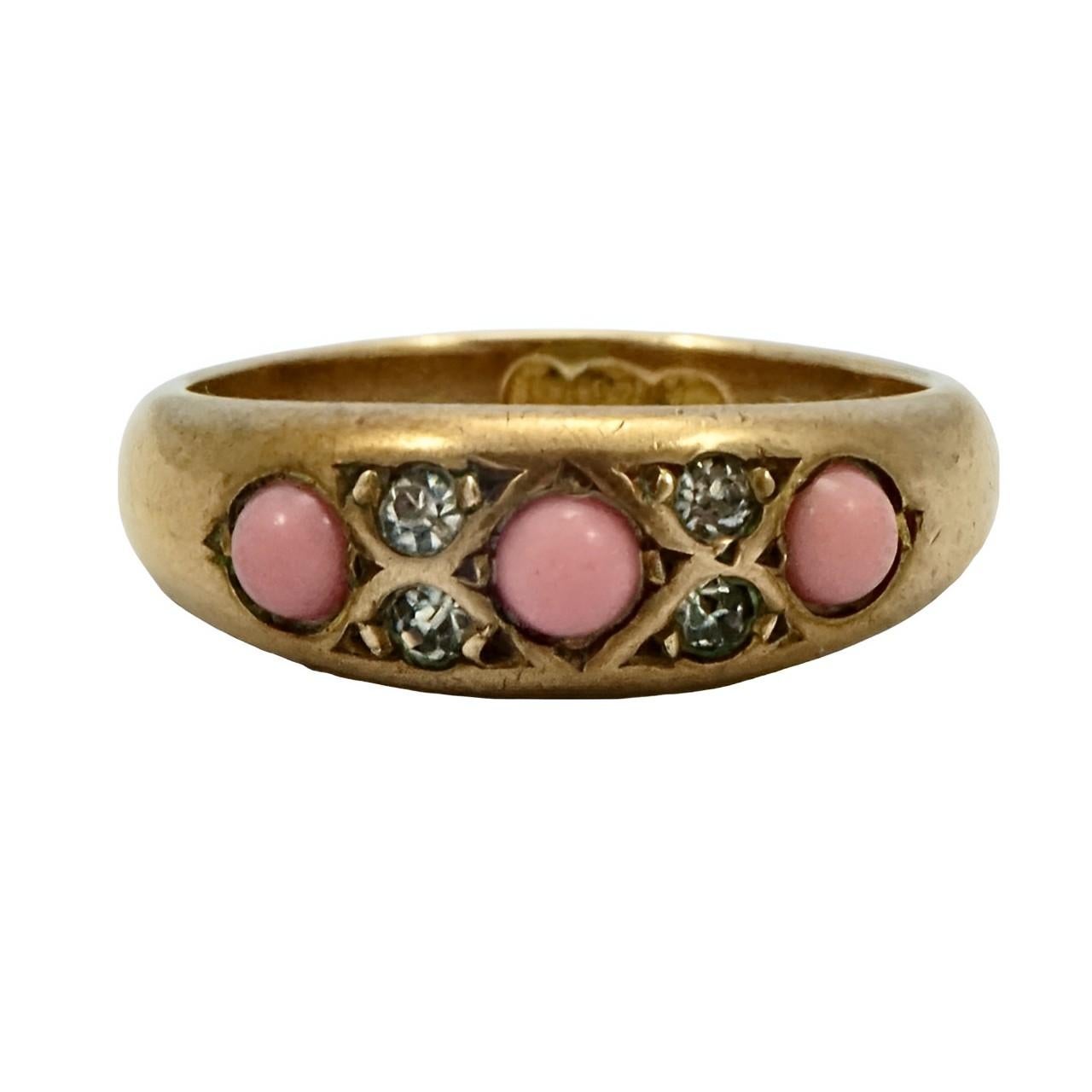 Beautiful antique gold gilt metal ring, set with three pink glass stones and four clear paste stones. Ring size UK J 1/2, US 5, and measuring inside diameter approximately 1.6 cm / .6 inch. There is wear and scratching as expected.

This is an