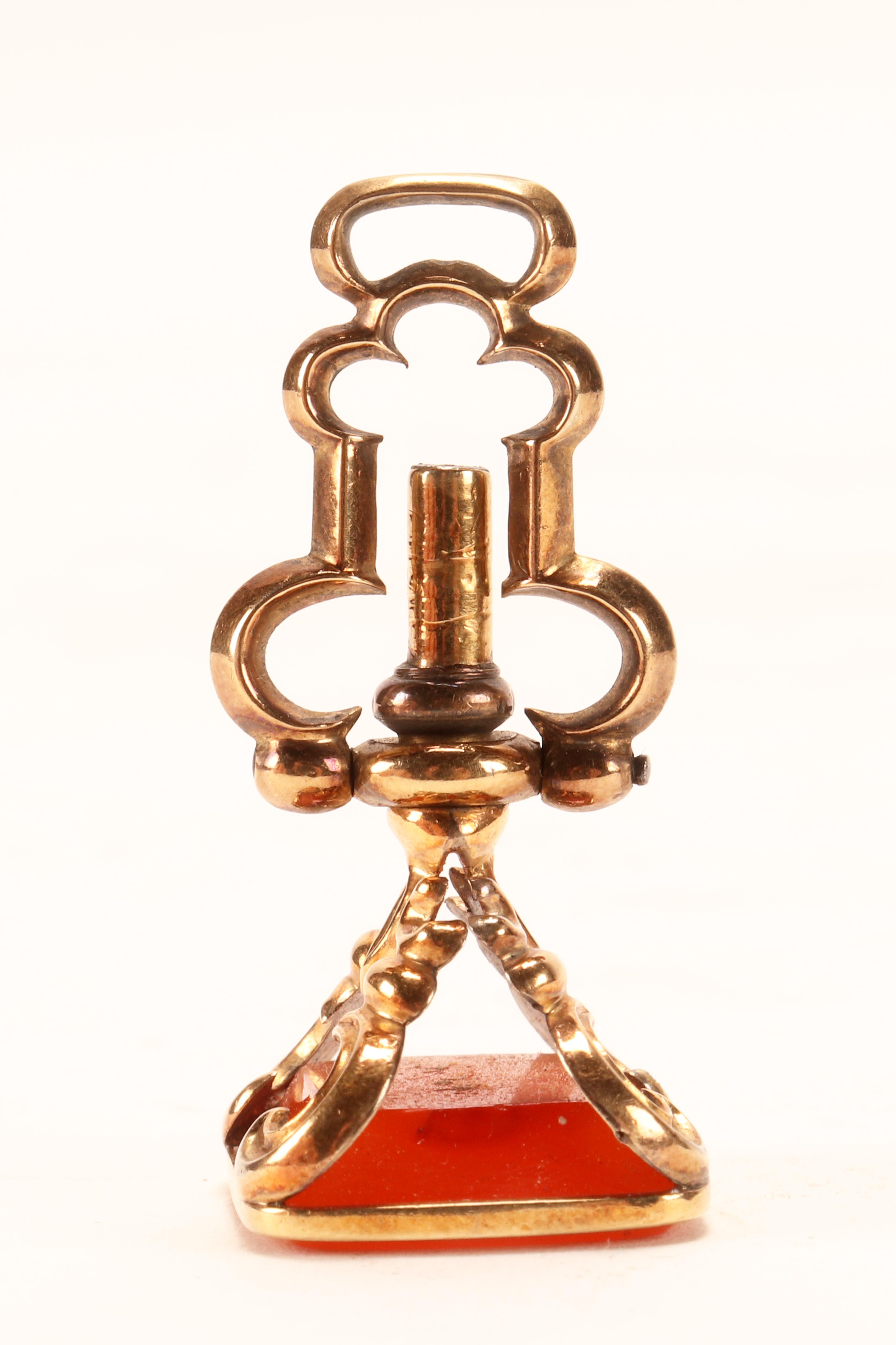English Antique gold hidden watch key spinning carnelian pendant, England 1870.   For Sale