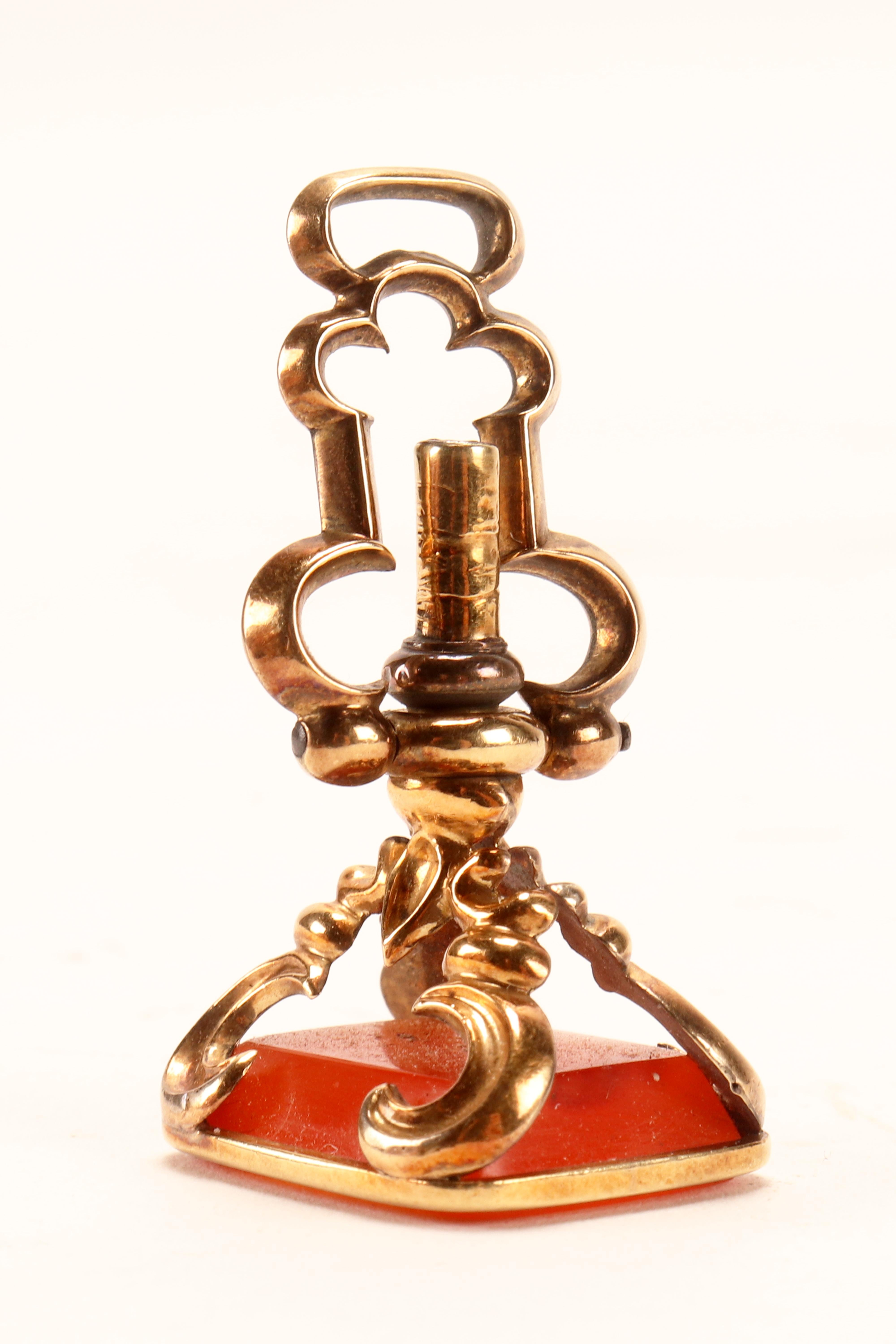 19th Century Antique gold hidden watch key spinning carnelian pendant, England 1870.   For Sale