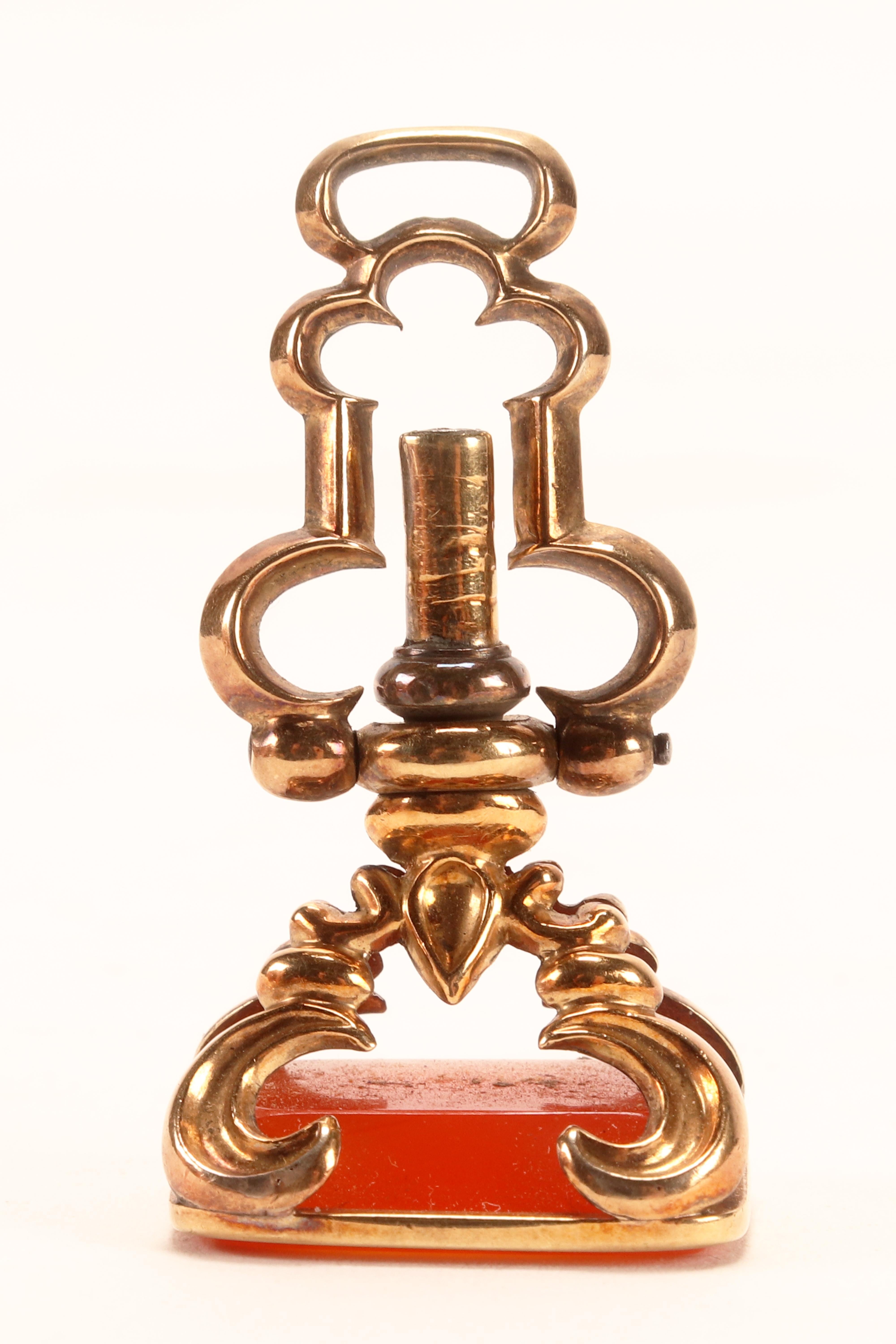 Antique gold hidden watch key spinning carnelian pendant, England 1870.   For Sale 1