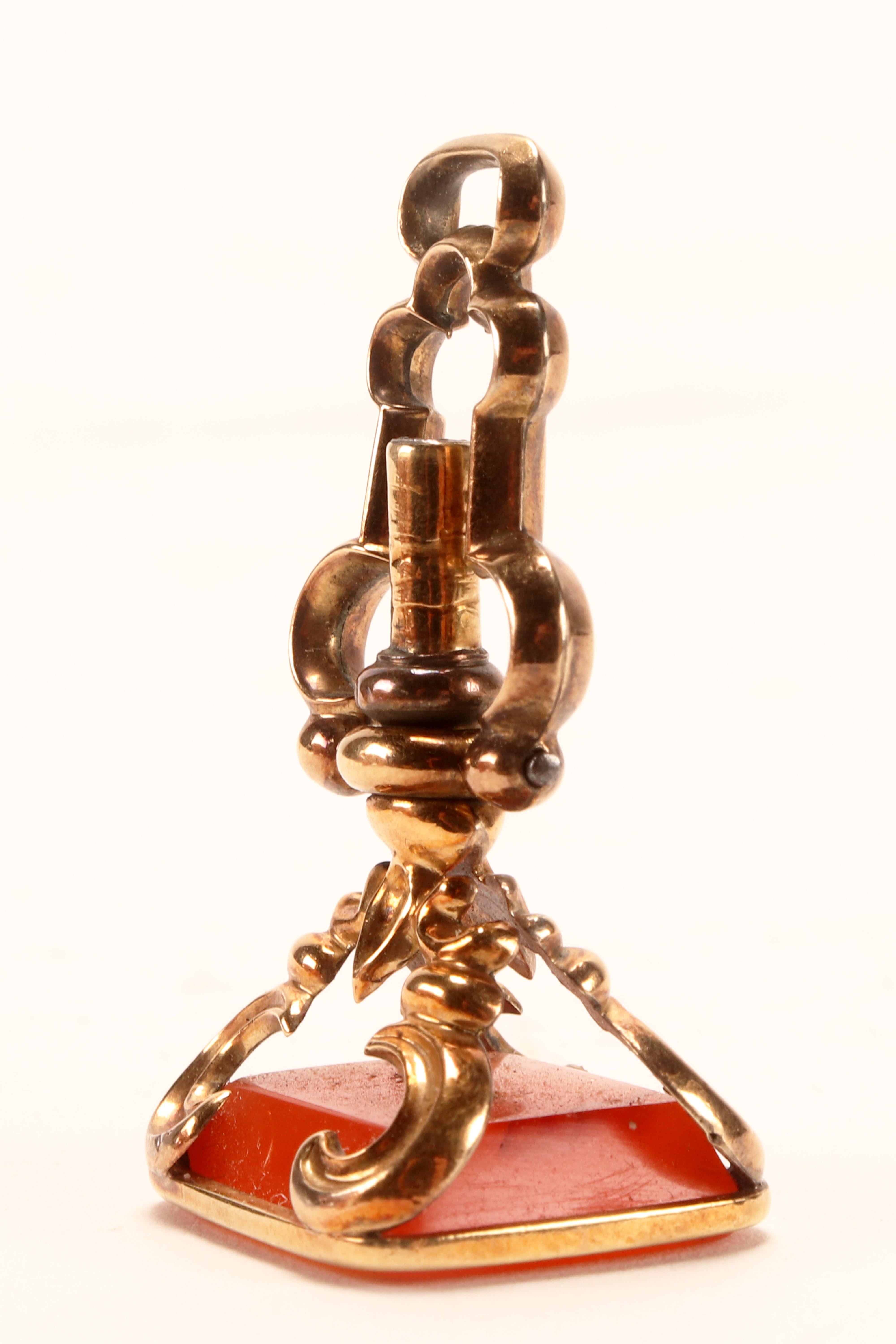 Antique gold hidden watch key spinning carnelian pendant, England 1870.   For Sale 2
