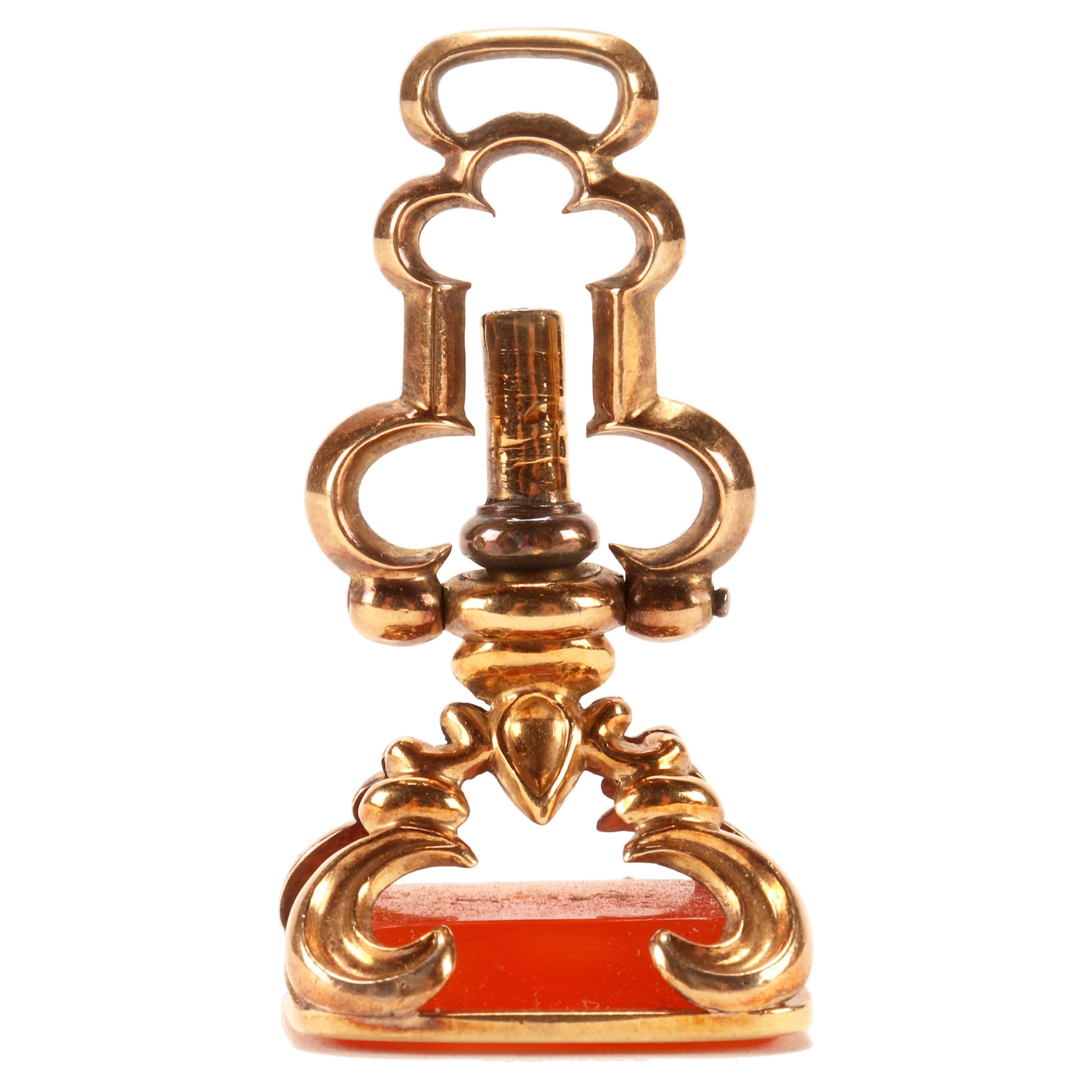 Antique gold hidden watch key spinning carnelian pendant, England 1870.   For Sale