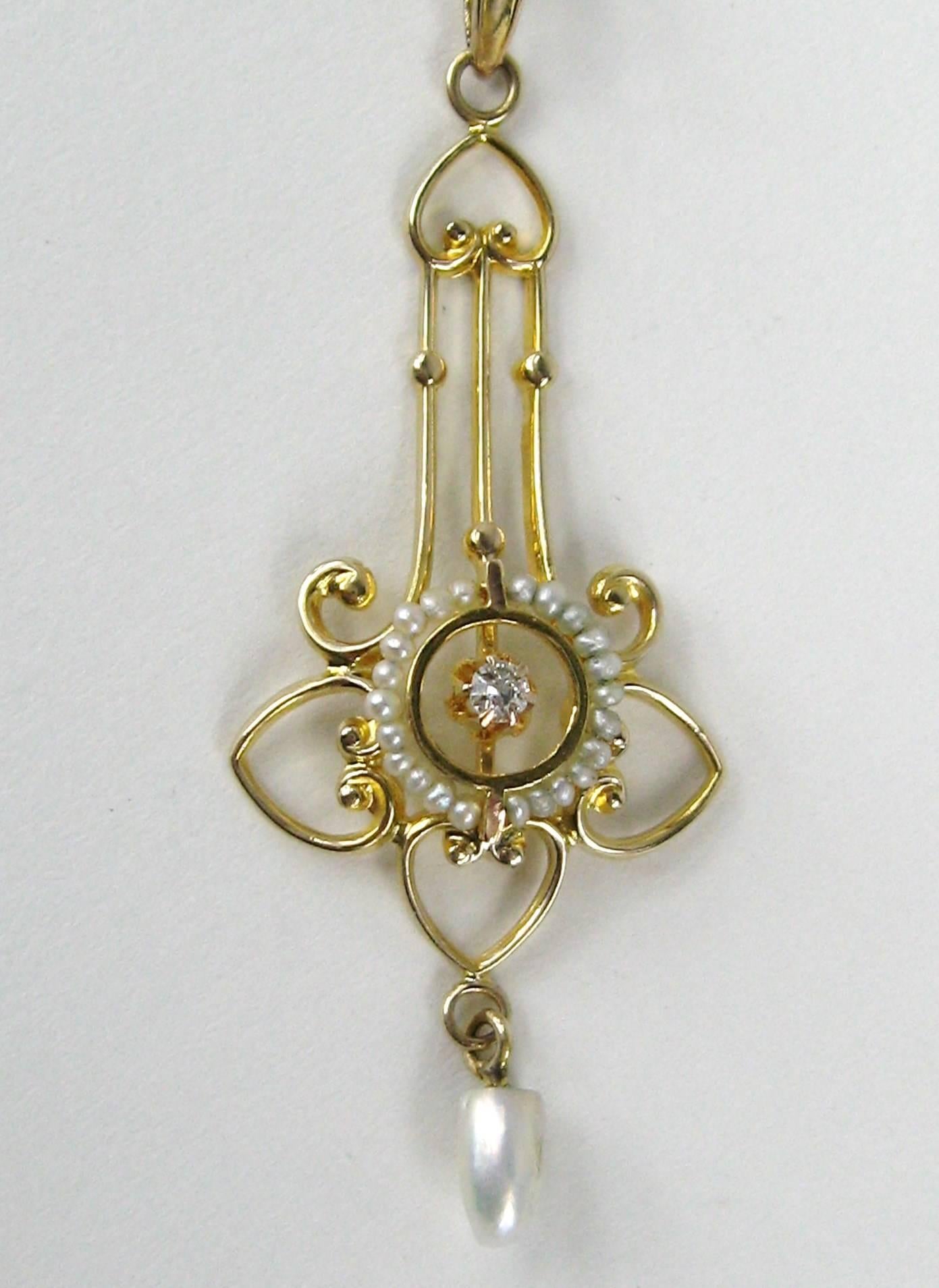 Truly superb Victorian era lavalier circa 1880s handcrafted beautifully in yellow gold. Accent Diamond surrounded by petite seed pearls. Stunning piece Measuring. The chain is 19.25 in end to end. The Lavalier is 1.66 in long x .61 in wide. This is