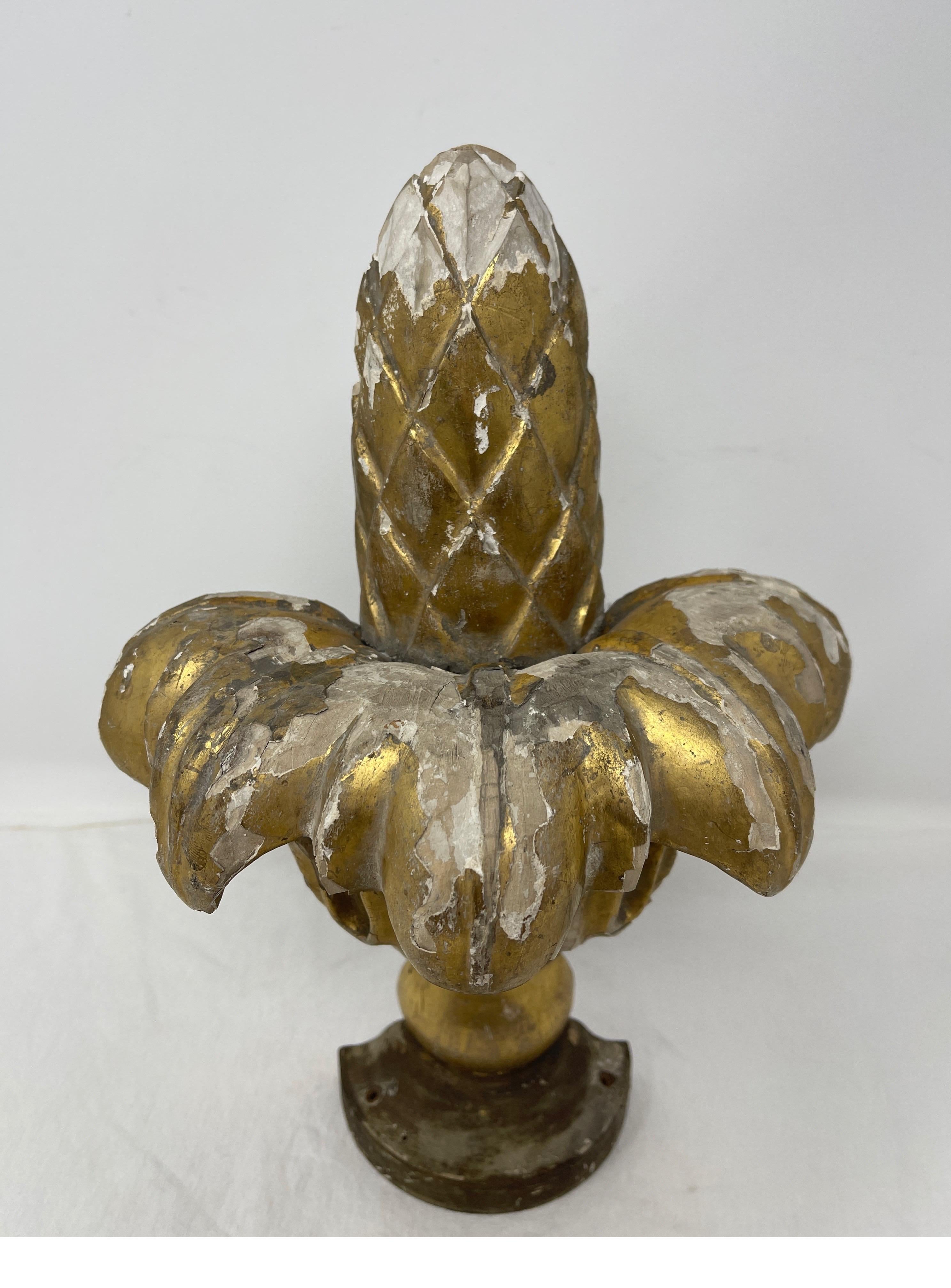 This beautifully aged gold leafed finial in the traditional shape of a cone would beautifully compliment any mantel or desk. This architectural element could also hang on a wall as an art piece.


Measures: 5”D x 8 1/2”W x 12 1/2”H.