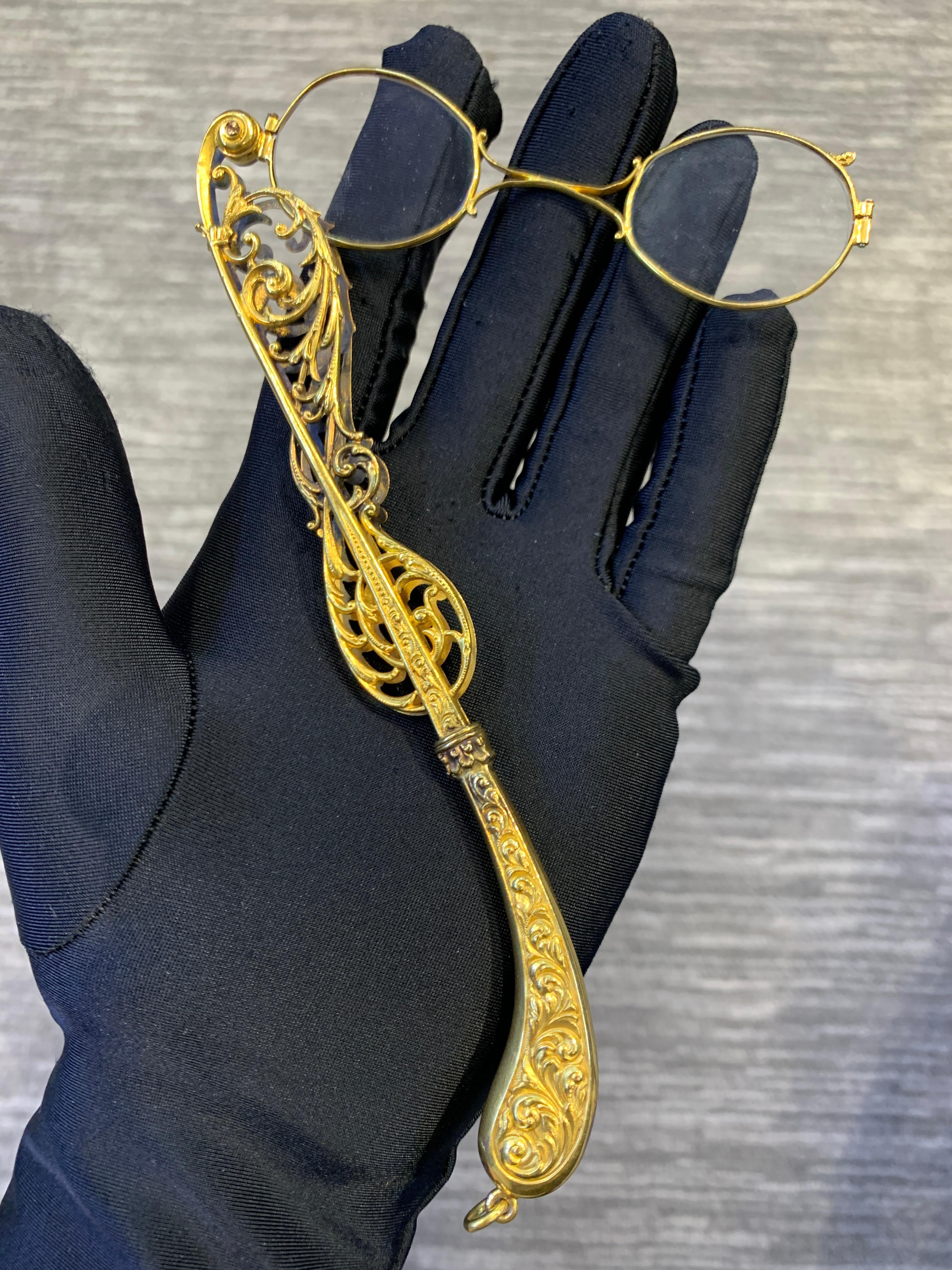 Antique Gold Lorgnette

An intricately designed yellow gold lorgnette with folding opera glasses.

Handle Length: 6.75