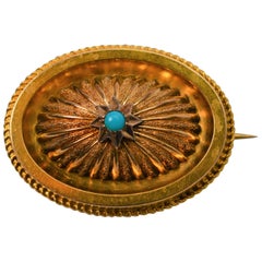 Antique Gold Medallion Brooch with Turquoise Accent