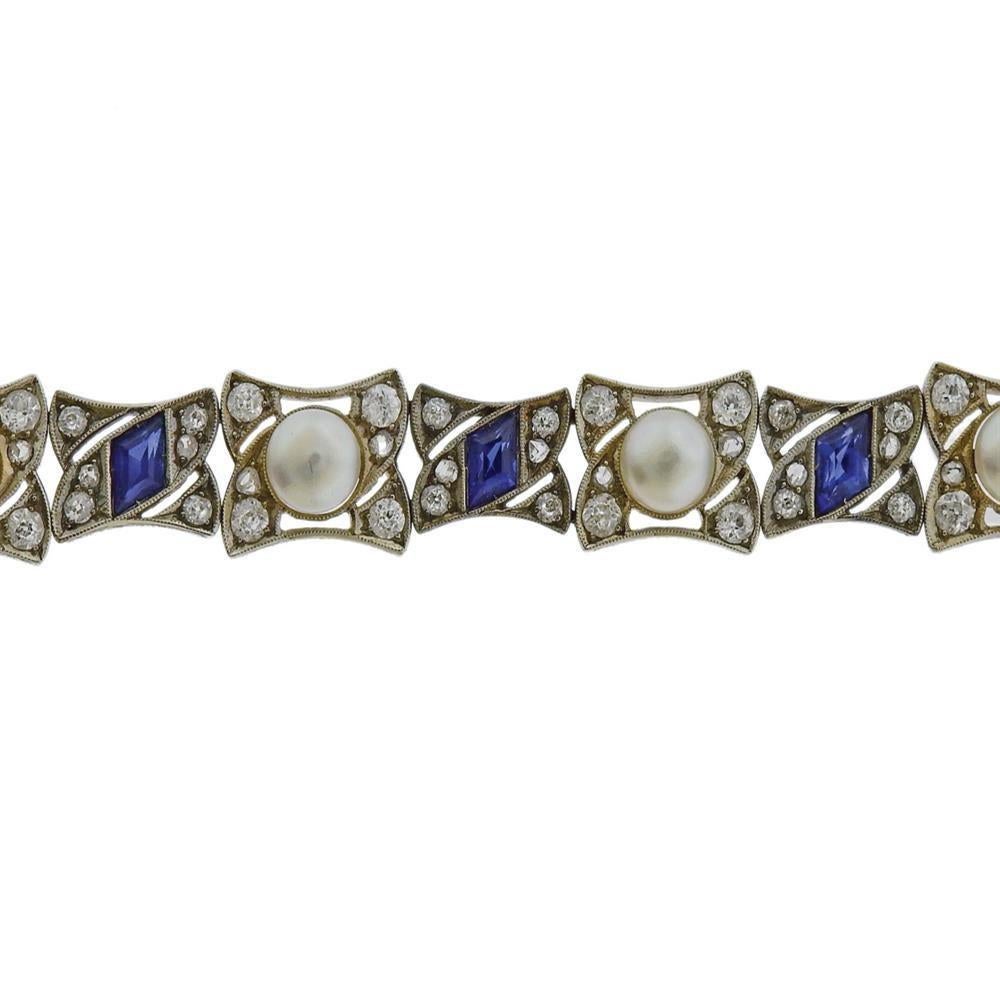 Antique 18k white gold bracelet, set with 8 natural pearls - measuring approx. 5.2mm to 6.2mm in diameter. Surrounded with blue stones and approx. mixed cut diamonds (rose and old/euro cut).  Bracelet is 7