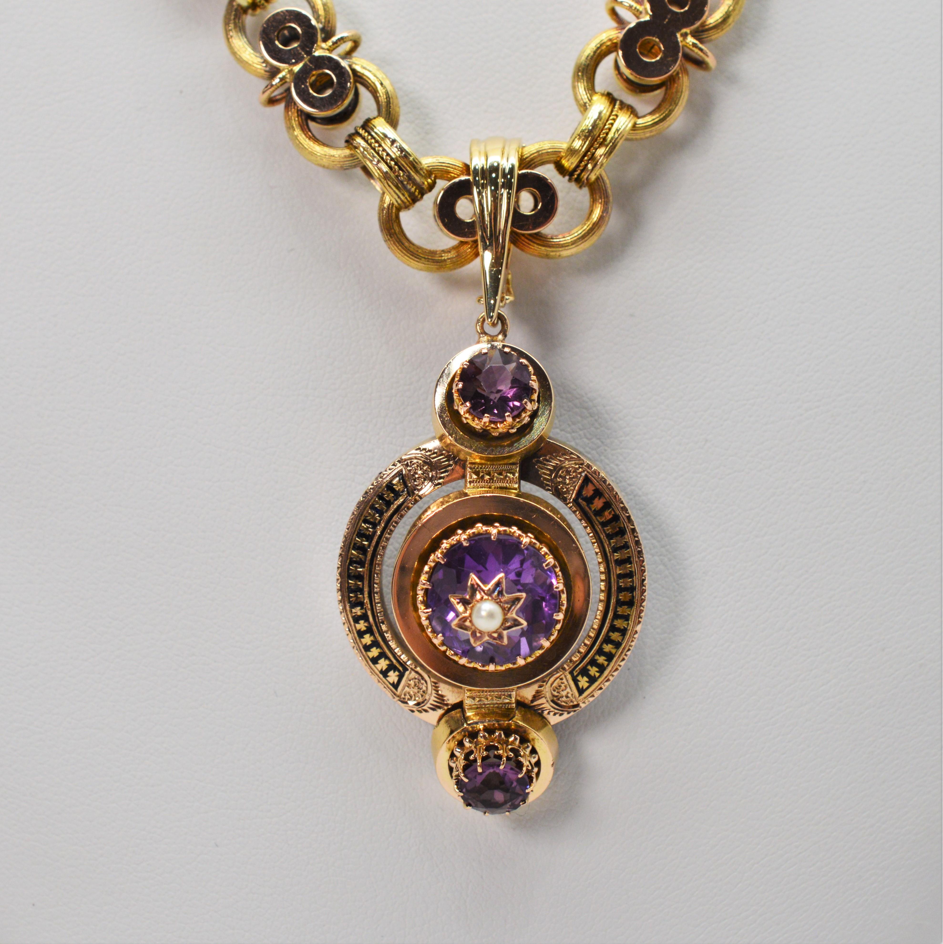 Uniquely intricate necklace of antique chain in fourteen carat 14K yellow gold carry this regal charm pendant enhancer with over eight carats of deep purple amethyst gemstone The removable medallion shaped enhancer measures 1-1/2 by 1 inch and