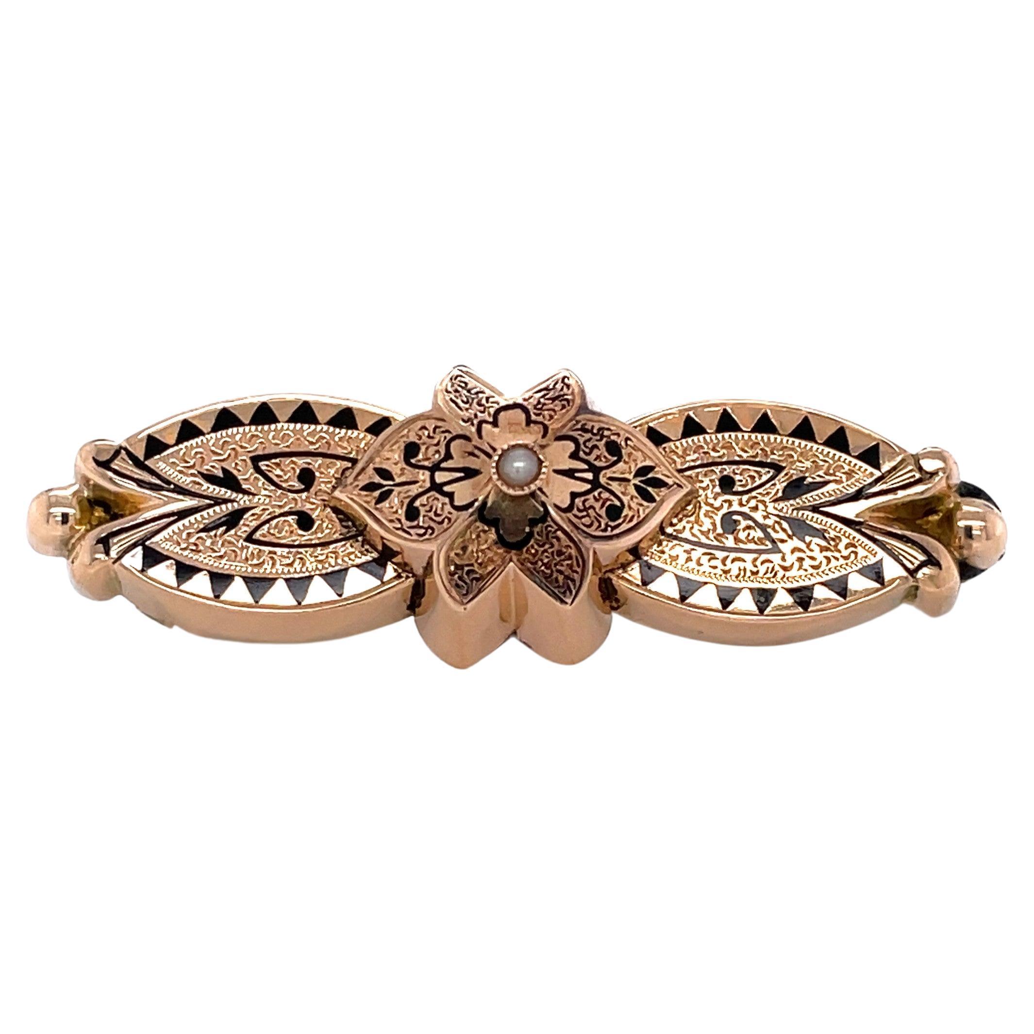 Broche ancienne à nœud papillon en onyx et or avec perles