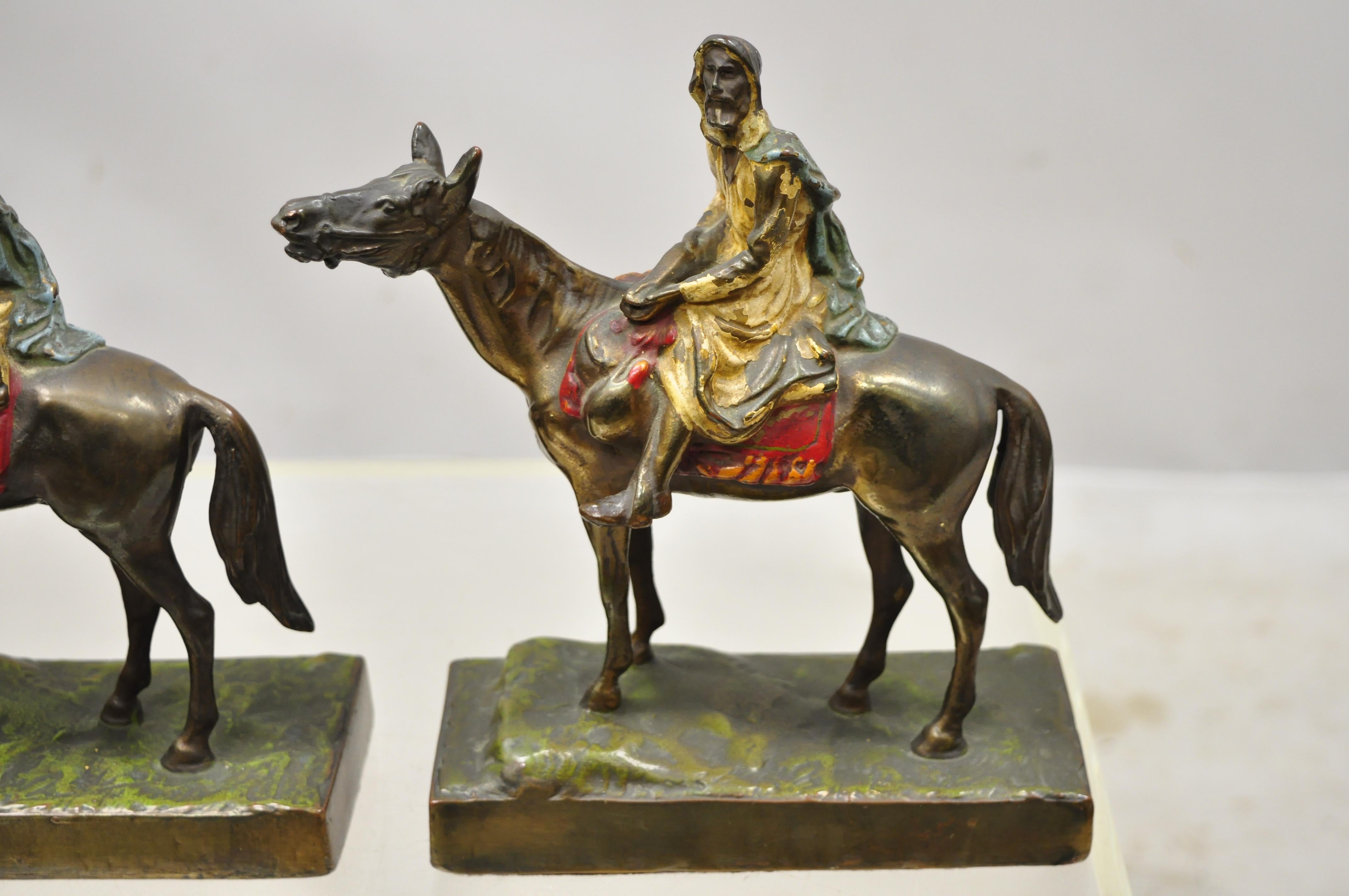 Antique gold painted bronze Polychrome Moorish Arab horse rider bookends - a pair. Item believed to be bronze but unconfirmed, Circa early to mid 1900s. Measurements: 9