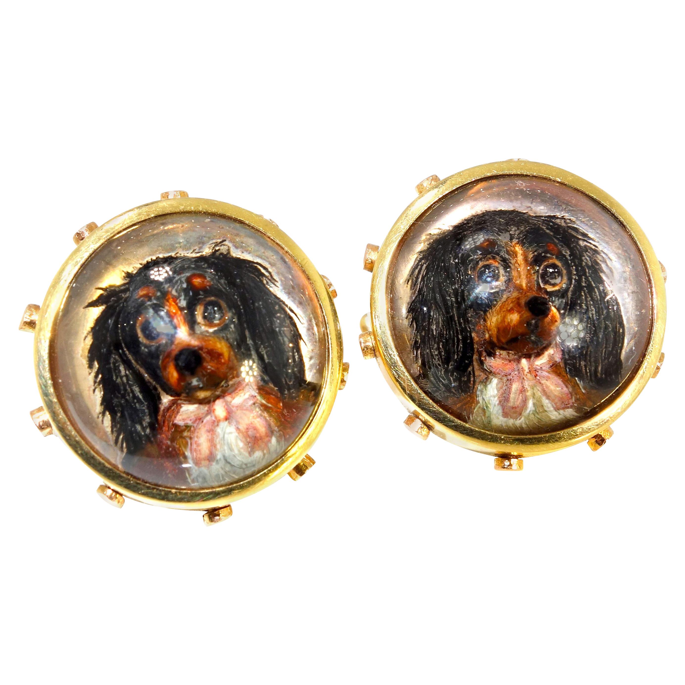 Antique gold painting under rock crystal, these finely painted dogs brimming with personality was made circa 1890.  In both yellow and rose gold,  notice the dog bone on the other side of the 