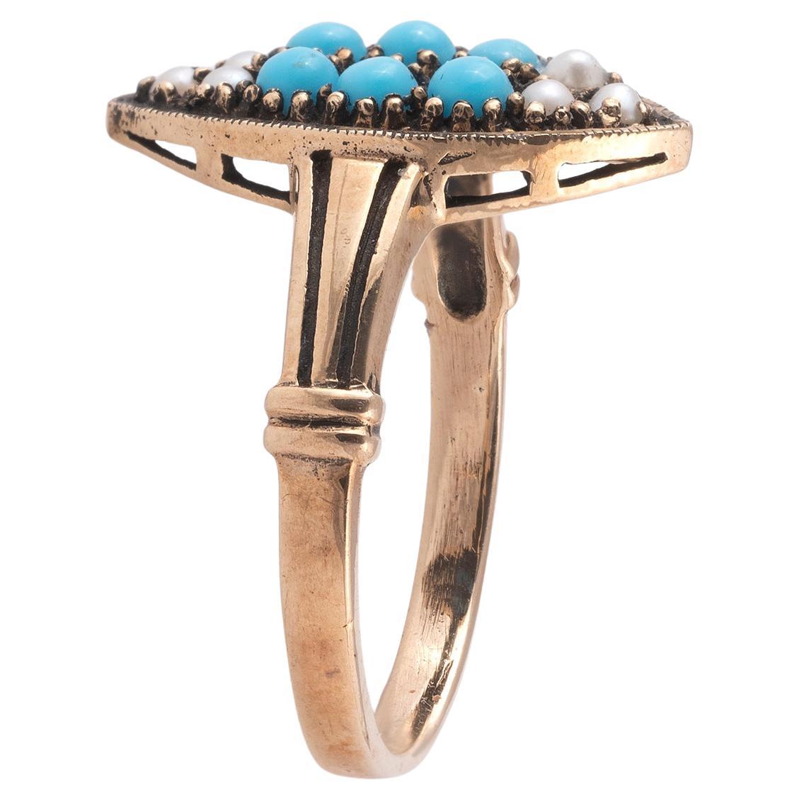 Marquise shaped ring pave set with pearl and turquoise.
Mounted in 14Kt yellow gold.
Finger size: 6 1/2
Weight: 3.7 gr
