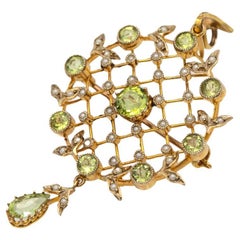 Antique gold pendant/brooch with peridots and pearls, Great Britain, early XXcen