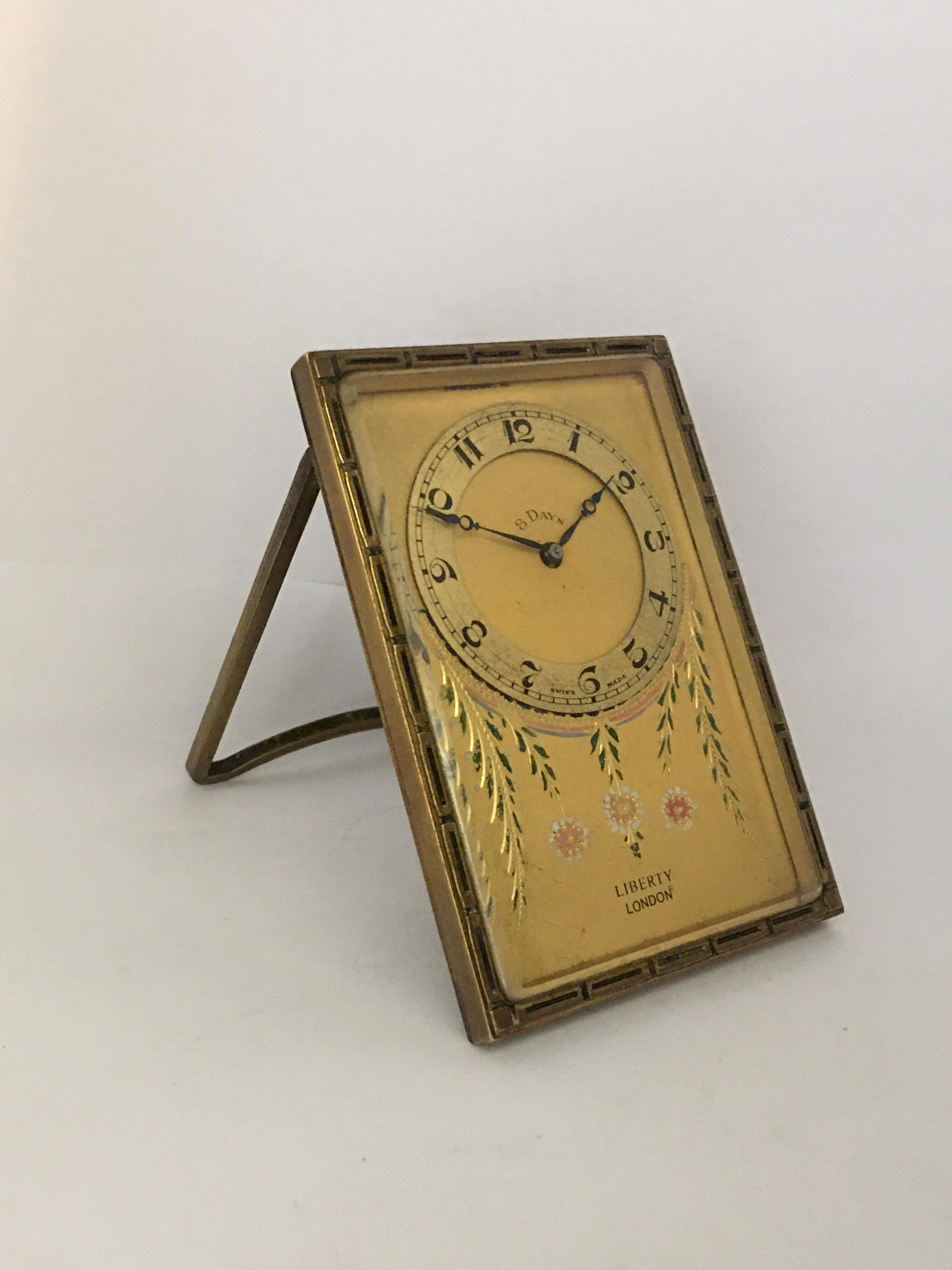 This beautiful antique gold gilt and enamel hand winding desk / travel clock is in good working condition and it is ticking well. Visible signs of ageing and wear with light surface marks and some tarnishes on the case as shown. Some tiny surface