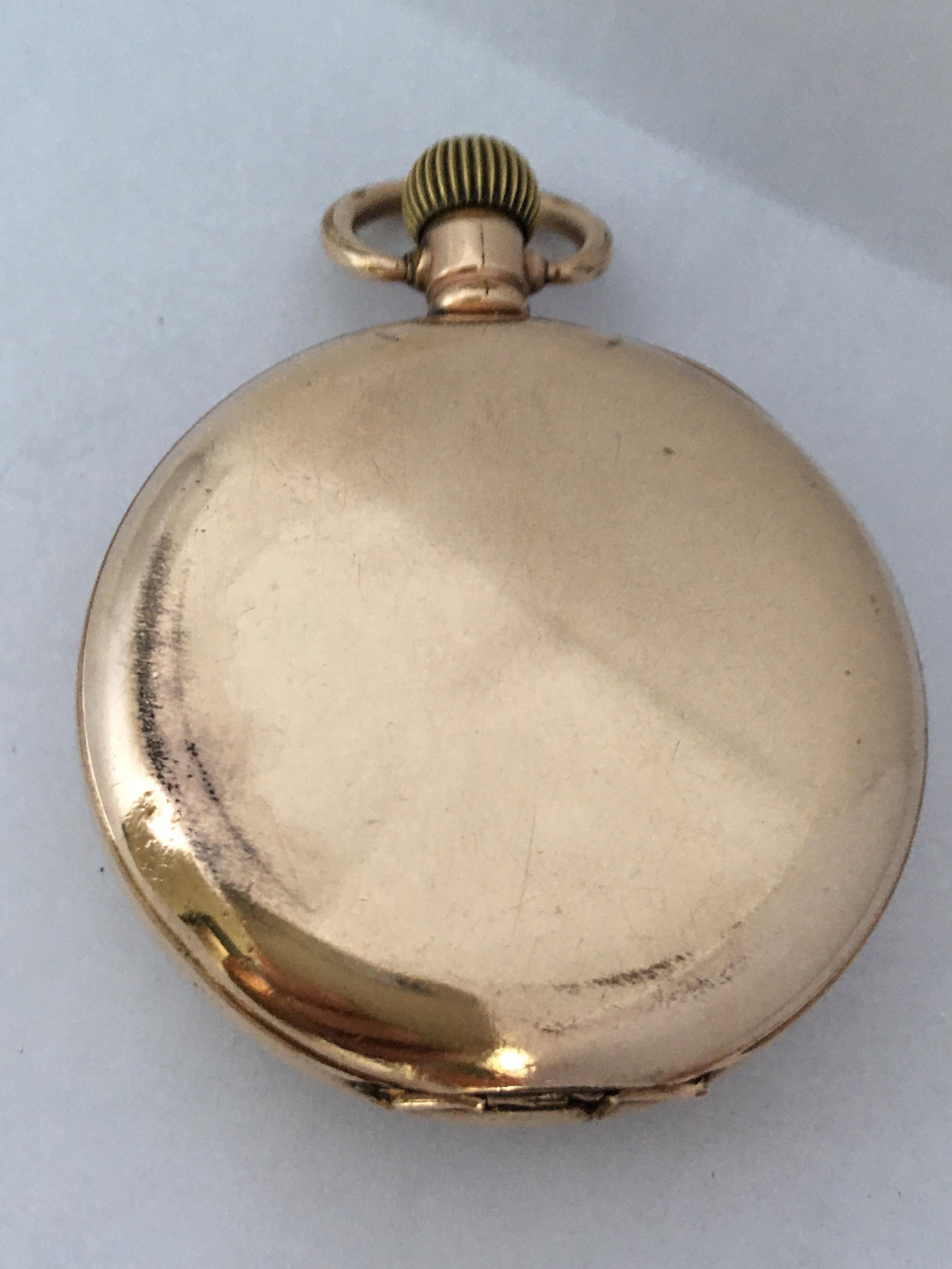This beautiful 50mm diameter antique gold plated pocket watch is in good working condition and it is running well. Some signs of ageing and wear with tiny and light surface marks on the glass and on the watch case and some tarnished and small dents