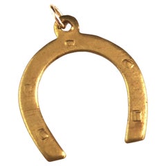 Antique gold plated horseshoe pendant 