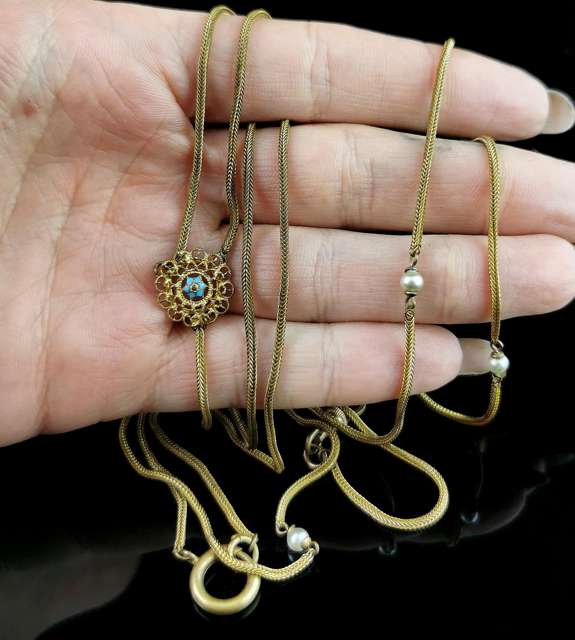 A beautiful antique, Edwardian era lariat necklace.

The necklace is a lovely foxtail link chain in gold plated brass, the chain is a Y shape or lariat necklace with a straight drop to the front, this is adorned with tiny faux pearls and terminates