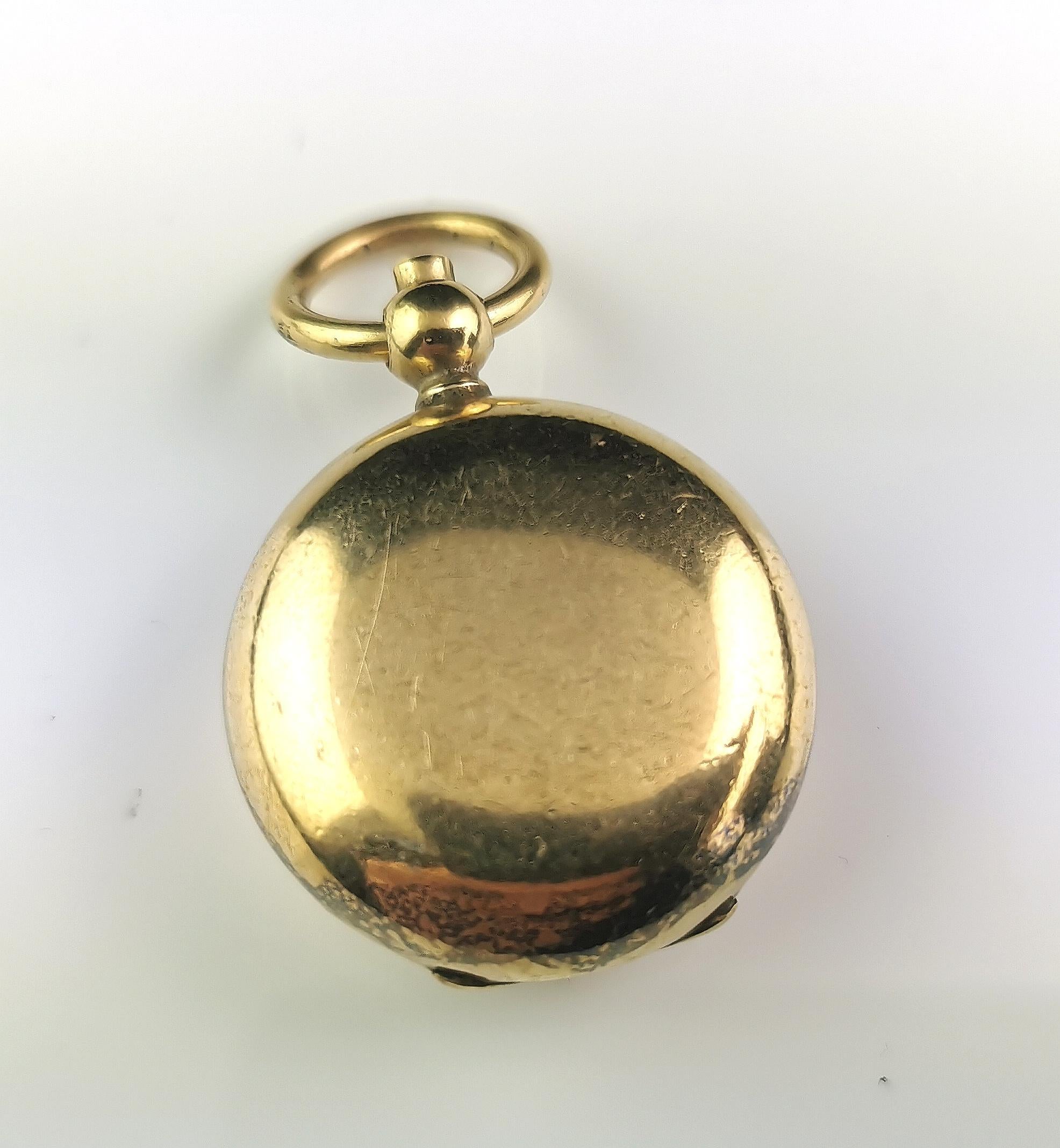 A handsome antique Edwardian era gold plated sovereign case.

This is a circular case with a single holder, made from gold plated metal it has a bow loop, ready to hang from your favourite long chain or Albert chain.

The sovereign holder was