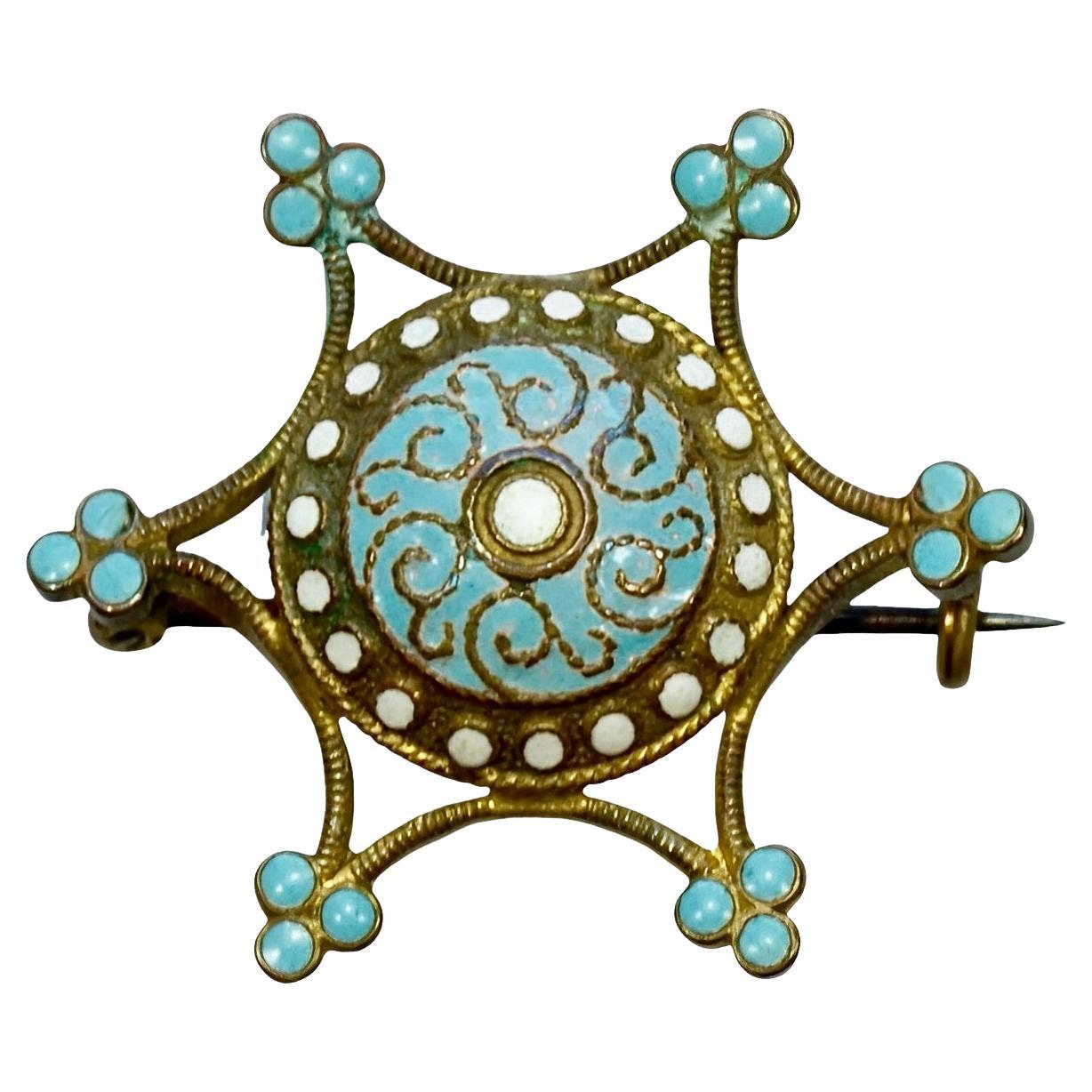 Spilla a forma di stella placcata in oro antico con smalto bianco e blu pallido