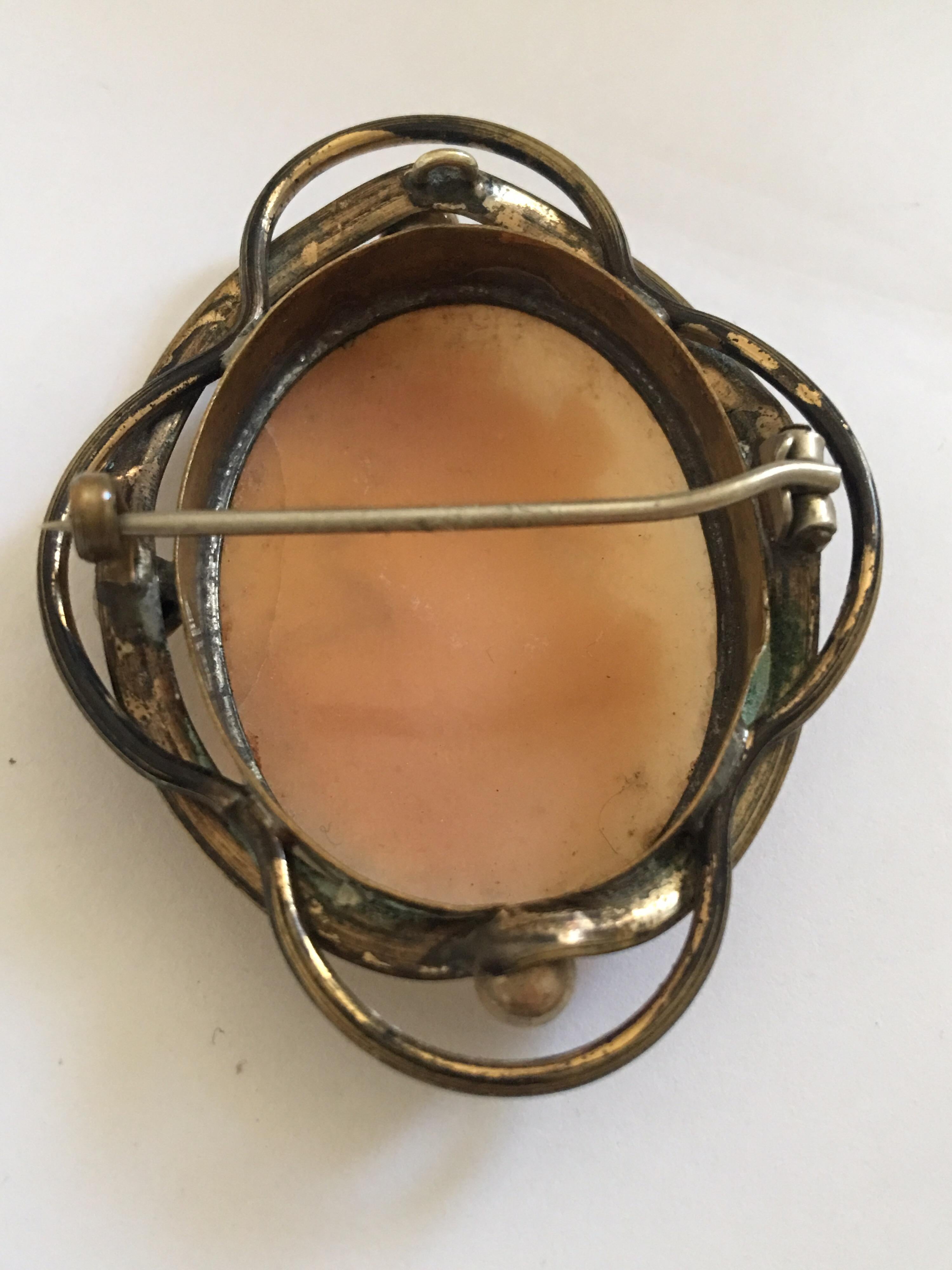 This beautiful Victoria Pendant / Brooch Cameo is in Fair condition. There is a visible cracks on the right hand side as shown. Please study the images carefully as form part of the description.