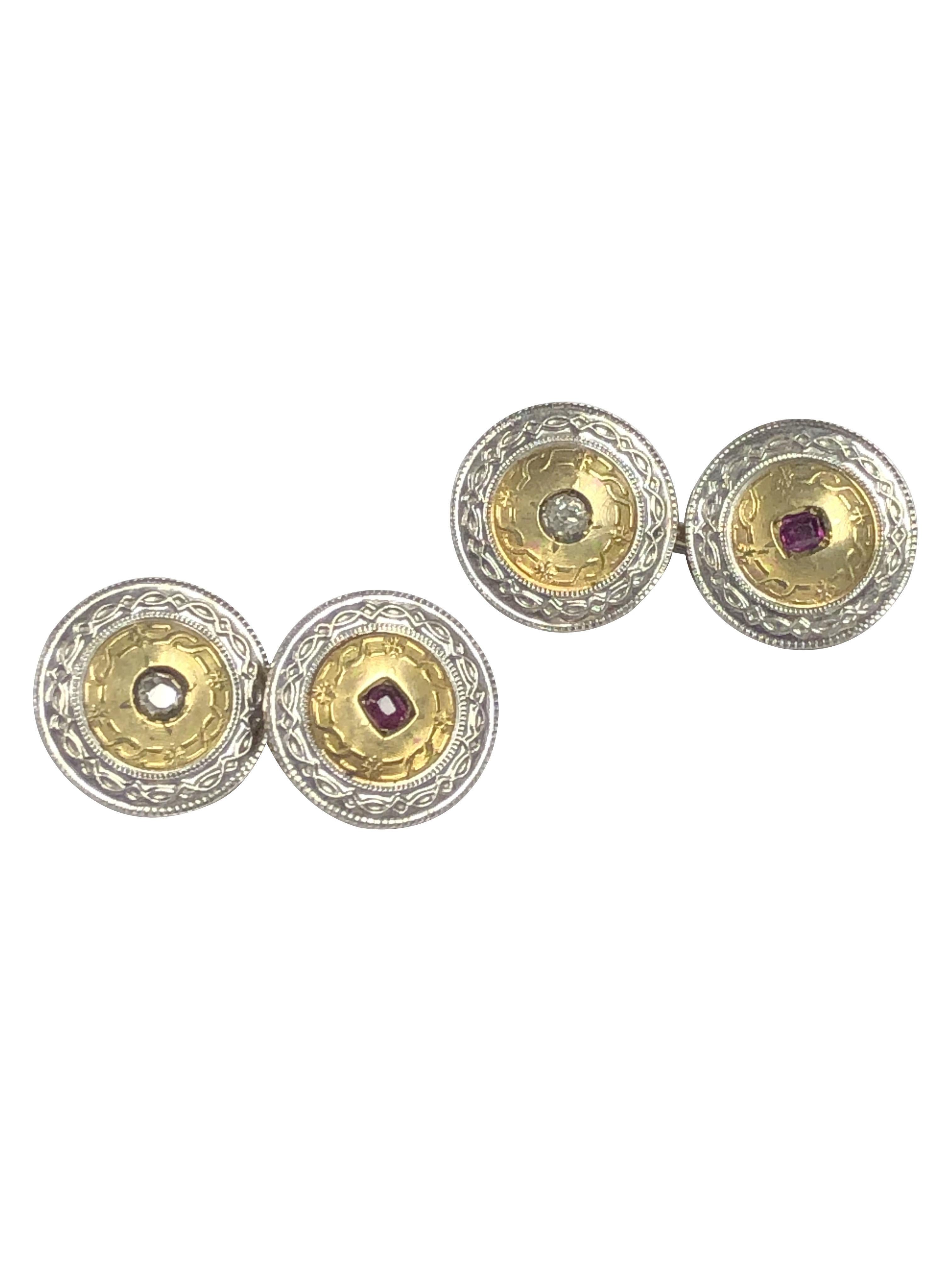 Circa 1915 14k Yellow Gold and Platinum Cufflinks, measuring 9/16 inch in diameter the double sided cufflinks have a hand finished Edwardian style pattern, set with Fine color Cushion Rubies and Old Mine cut Diamonds.