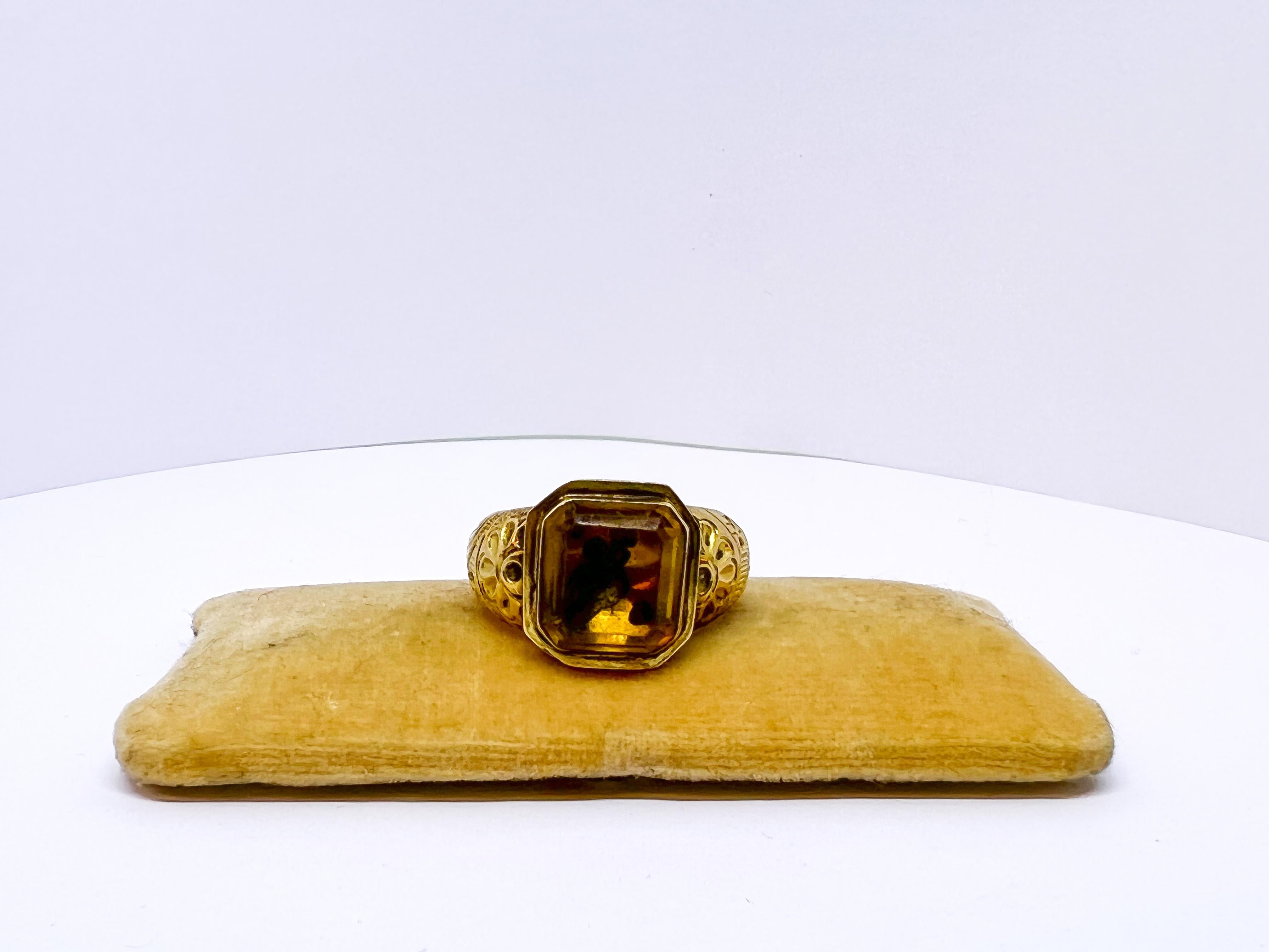 Antique Gold Ring 1855-1877 Tampere Finland.

Very rare indeed.
Stone most obviously Glass.
A great ring.
Author Wallin B.E Worked in Tampere in 1855-1877.
About 21mm in diameter