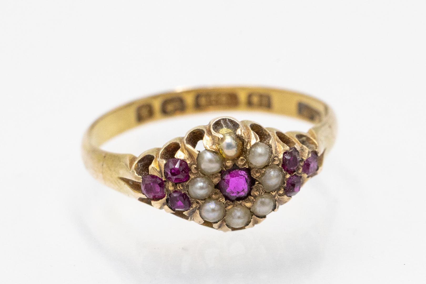 Antique gold ring with rubies and pearls, Birmingham, 1897.

Antique ring made of 15-karat yellow gold (0.625 fineness) with rubies and river pearls. The unique ring comes from Great Britain from the city of Birmingham in 1897. The hallmark is