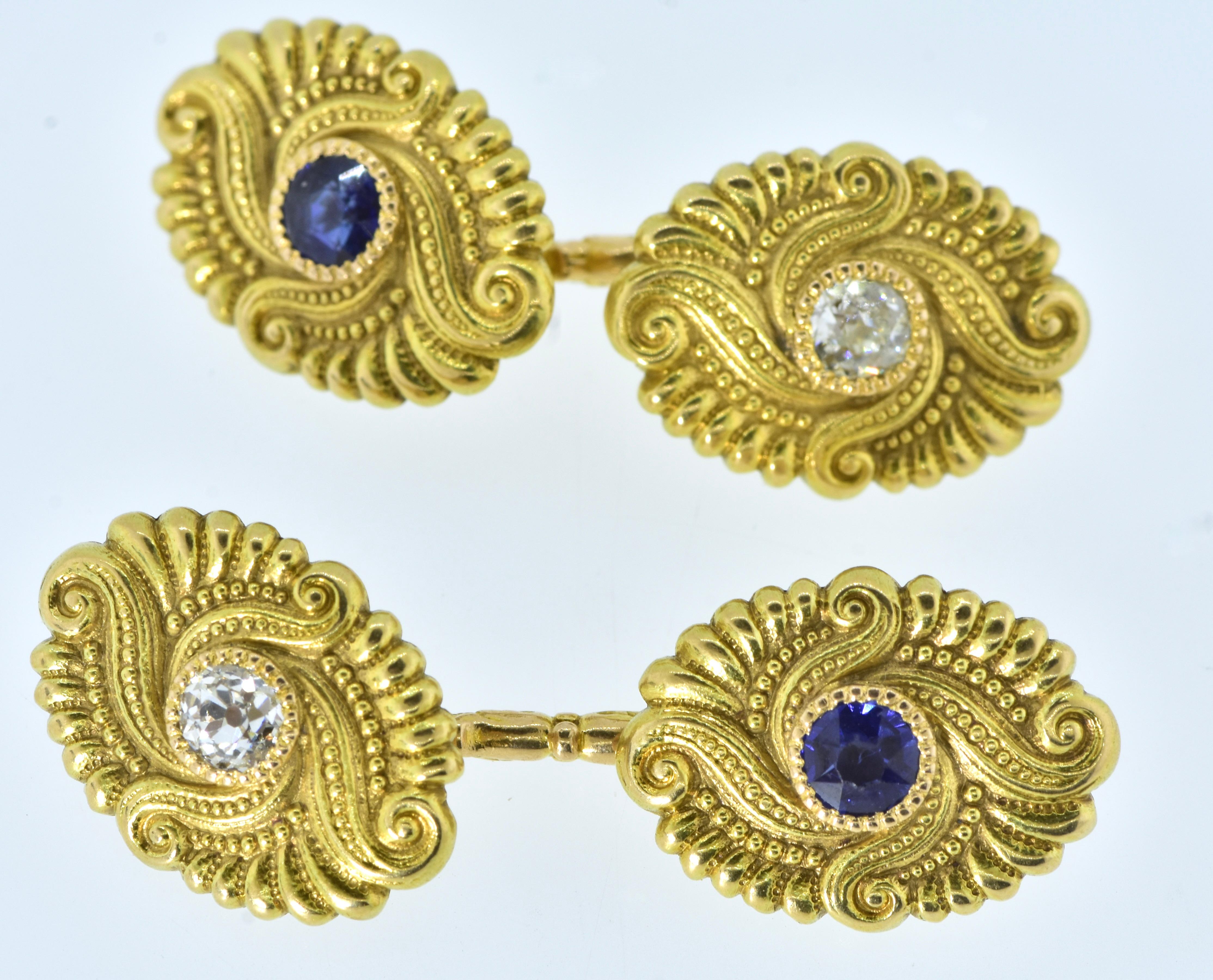 Antique cufflinks yellow gold  with European cut white diamonds weighing totally .40 cts.,  and bright vivid blue unheated sapphires weighing .45 cts. These distinctive cufflinks are in fine condition, and are just under .75 inches long.  They weigh