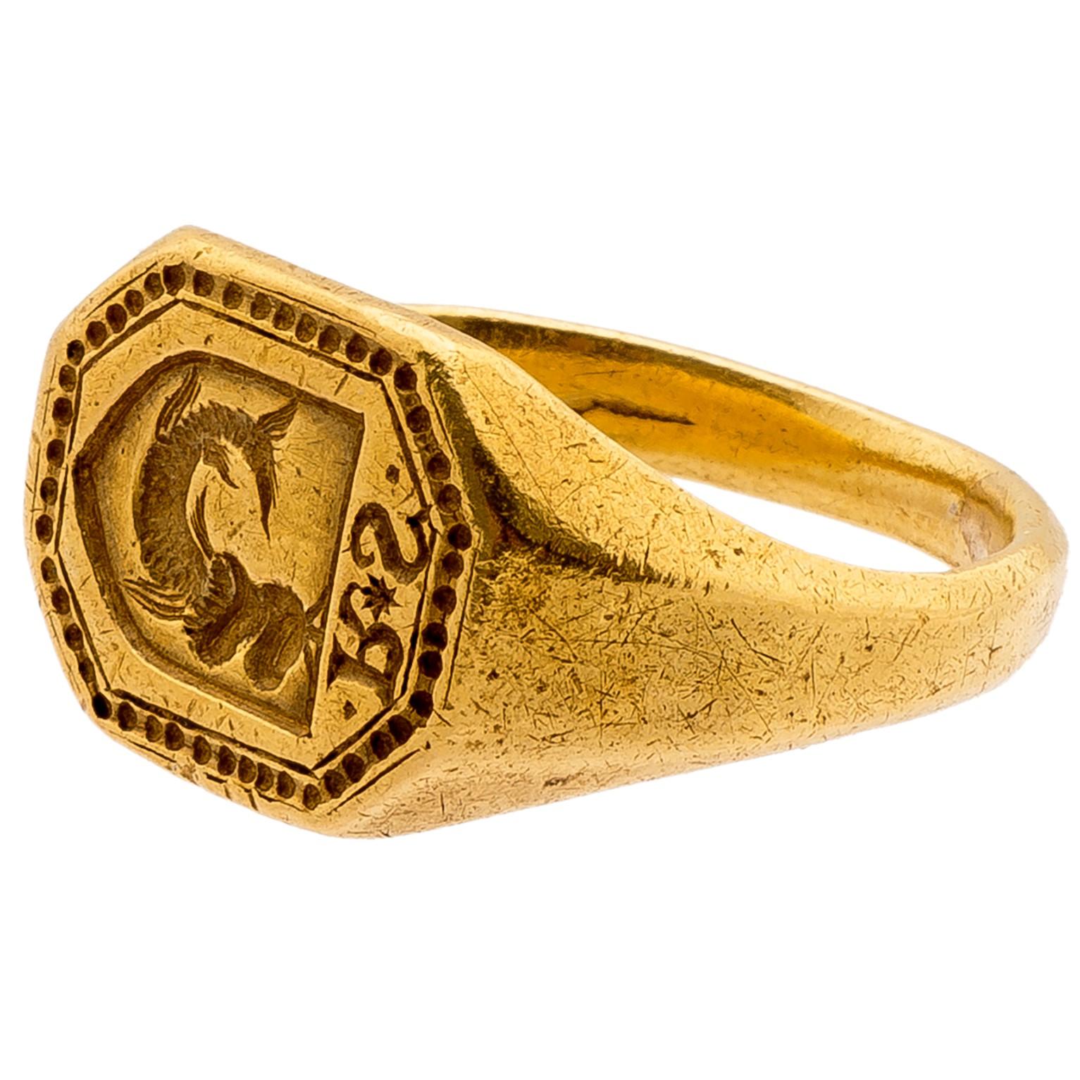 Renaissance Signet Ring with Helmeted Fish and Initials “R*S”
Western Europe, late 15th to early 16th century
Weight 13.3 gr.; bezel 16.2 x 12.9 mm.; circumference 62.86 mm.; US size 10 1/4; UK size U

The octagonal bezel with engraved line and