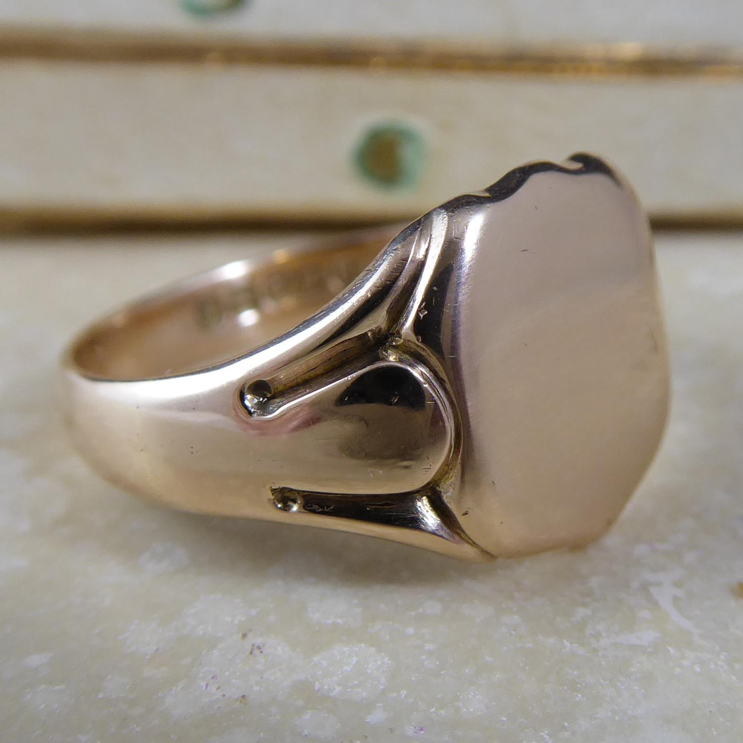 Fabulous antique gent's signet ring crafted inn 9ct rose gold in 1916.  The head of the ring is a plain polished shield shape to carved shoulders and D shaped cross section band.  Hallmarked at the Birmingham Assay Office.  Finger size 10