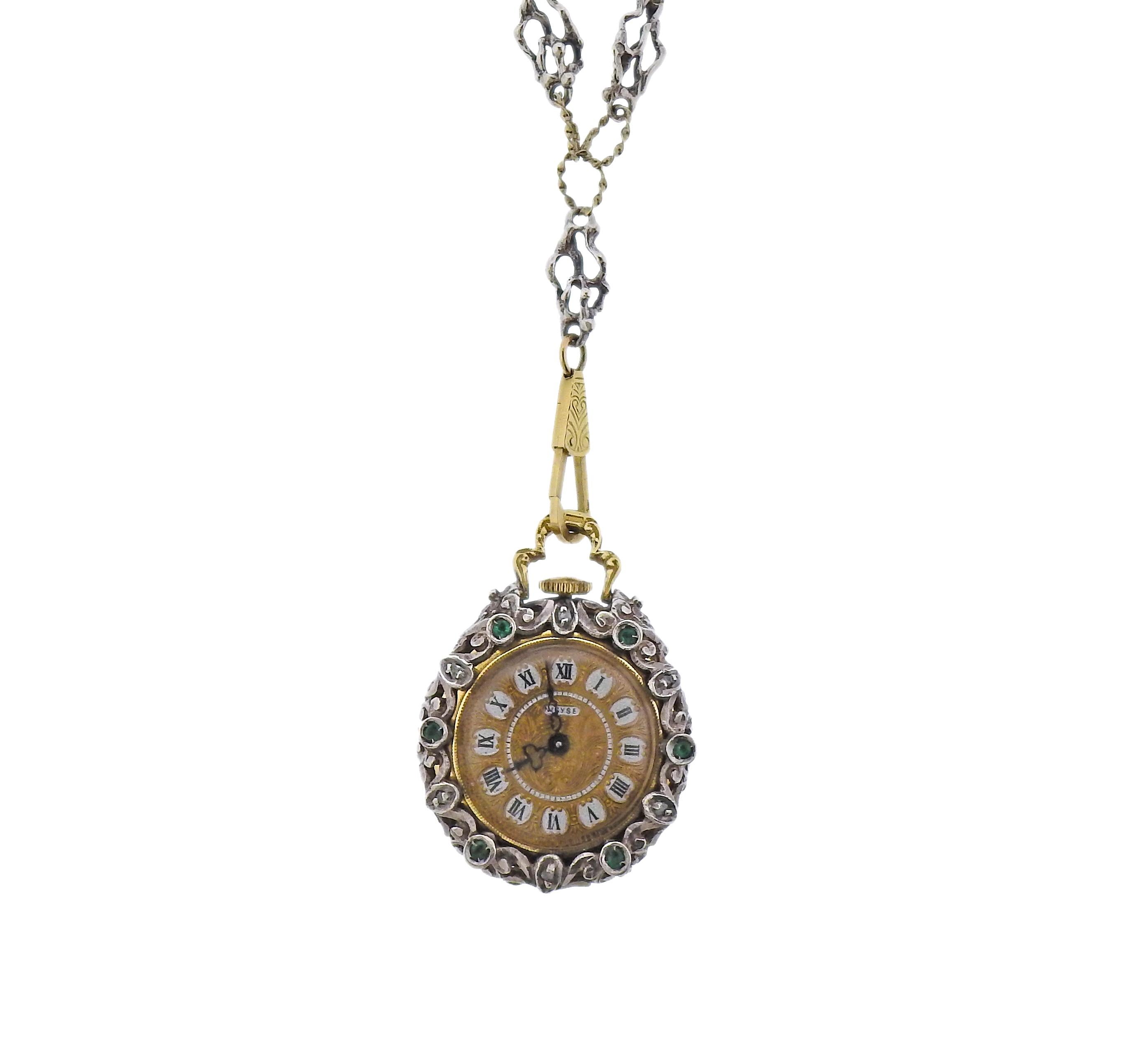 Antique silver and 14k gold chain with cage pendant, holding a pocket watch inside. Decorated with rose cut diamonds, enamel and  green gemstones. Pendant is 29mm in diameter. Chain is 28