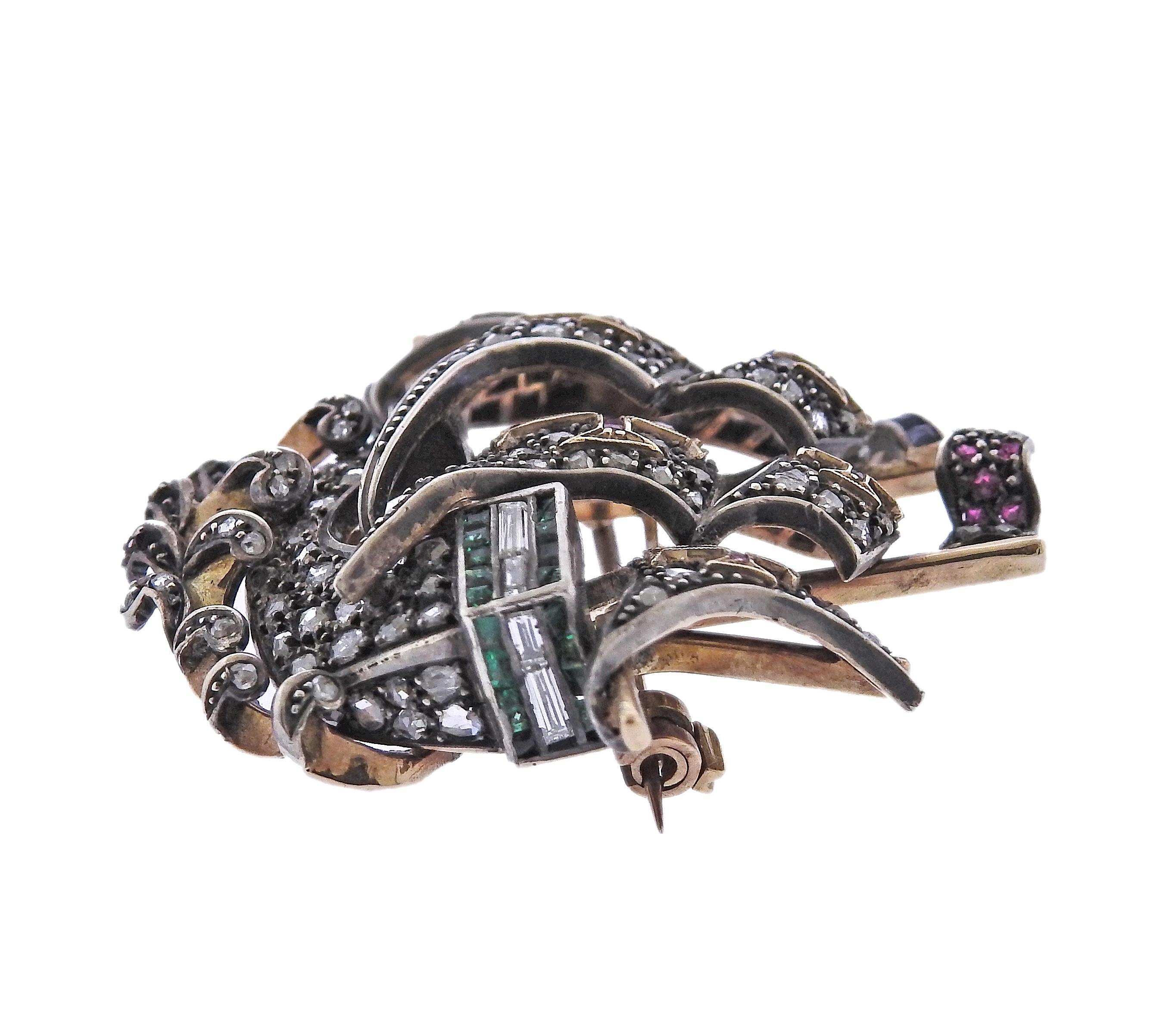 Antique 14k gold and silver top ship brooch, decorated with rose cut diamonds, rubies, sapphires and sapphires (multiple stones are missing/chipped). Brooch is 40mm x 39mm. Weight - 17 grams.