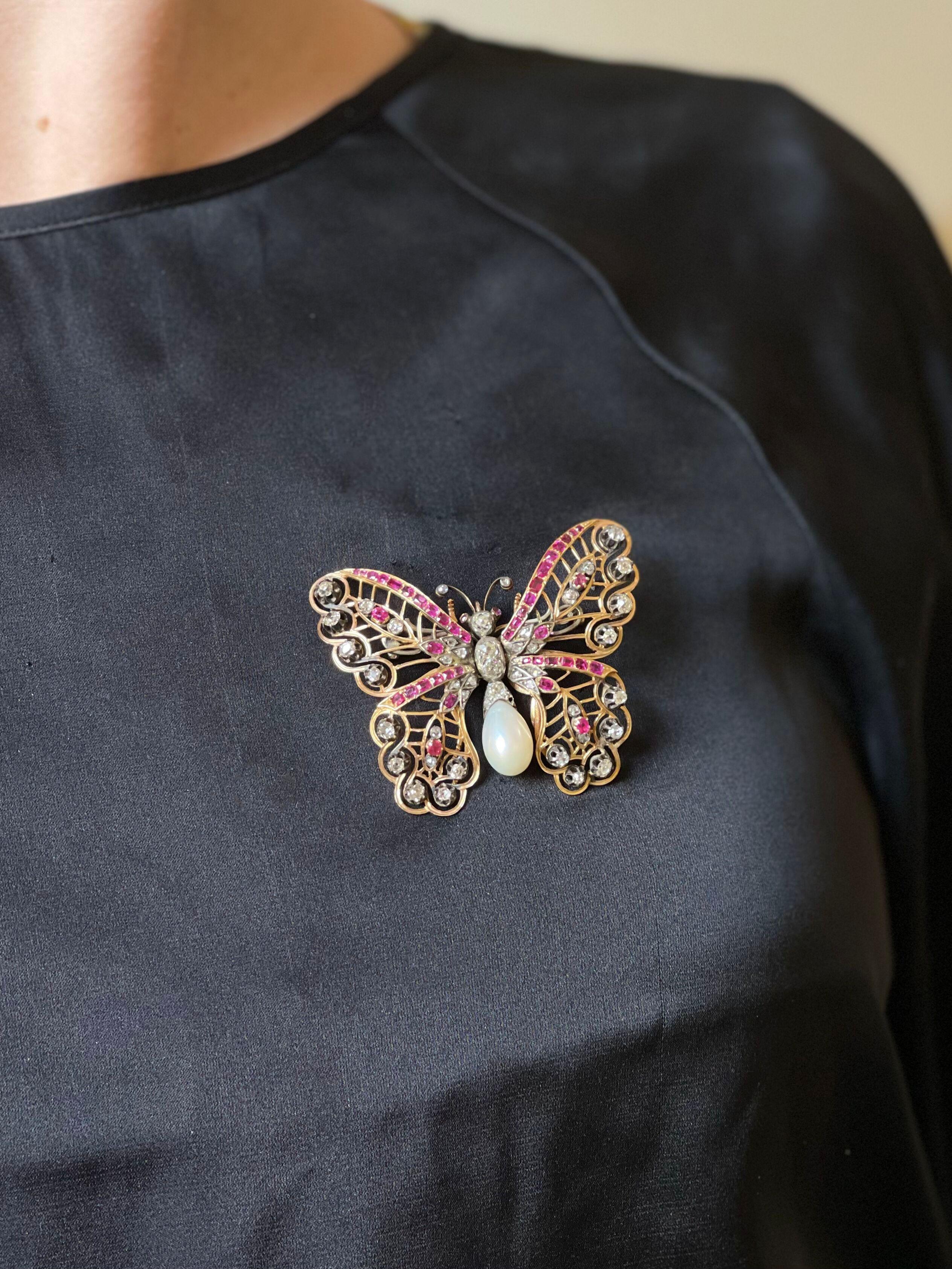 Antique 14k gold and silver butterfly brooch, set with rose and old mine diamonds - approx. 2.40ctw total, surrounded with rubies and a pearl. Brooch measures 2