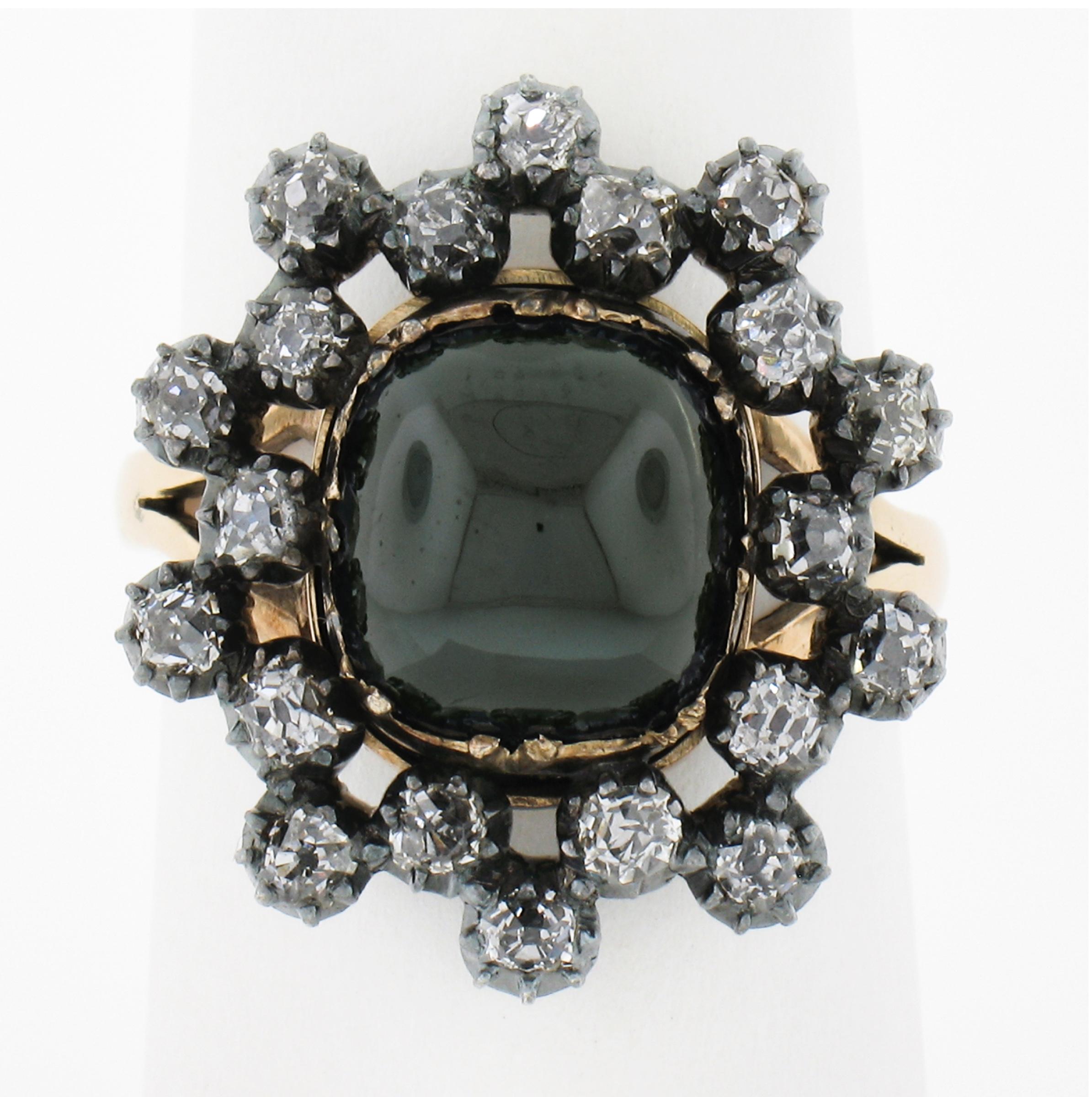 This fabulous antique cocktail ring is crafted in solid yellow gold and silver top. It features a wonderful, GIA certified, natural sapphire that displays dark greenish blue color, surrounded by old mine and Peruzzi cut diamonds that add a glamorous