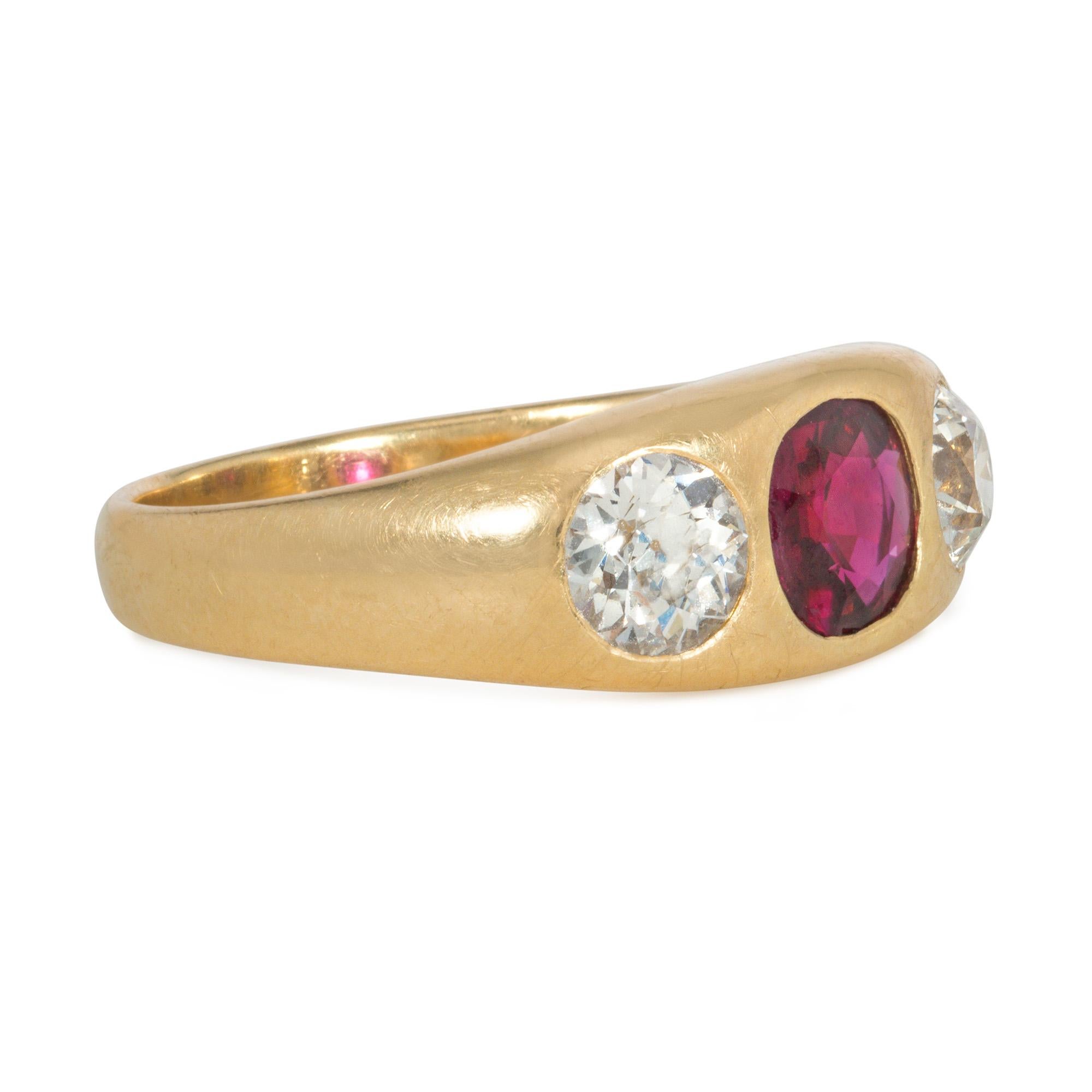 An antique Victorian gold and three-stone band ring comprised of a cushion-cut ruby flanked by two old European-cut diamonds, flush-set in 18k. Maker's mark FB. Ruby: Thai, 1.18cts.  AGL document no. 1132653. Two diamonds approximately 1.70