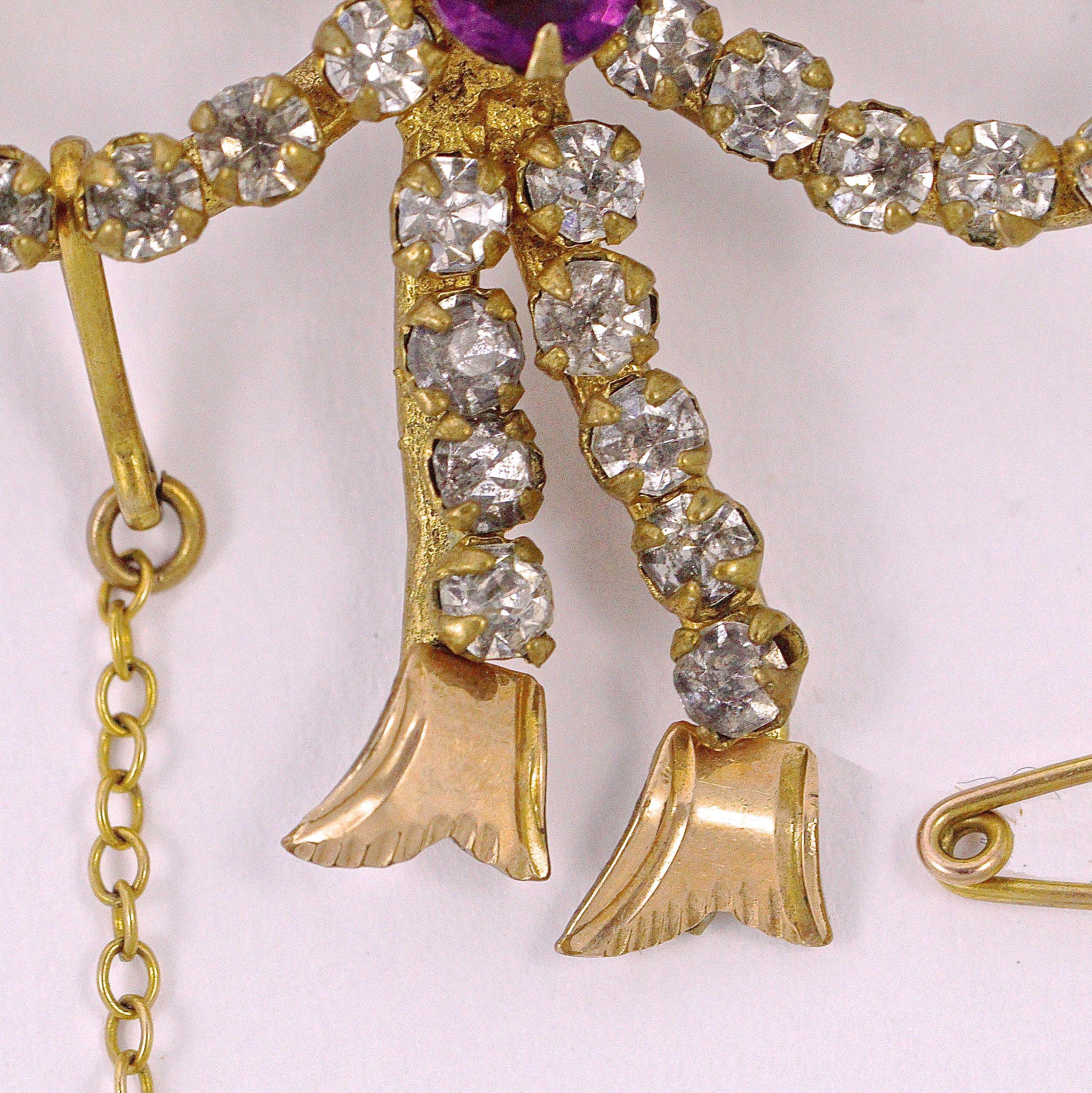 Antique Gold Tone Amethyst and Clear Paste Bow Brooch circa 1910 In Good Condition For Sale In London, GB