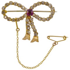 Antique Gold Tone Amethyst and Clear Paste Bow Brooch circa 1910