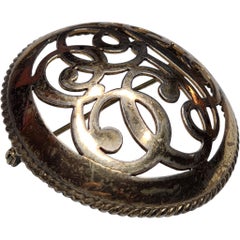 Antique Gold Tone Openwork Scroll Motif Round Brooch, Late 19th Century