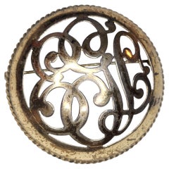 Antique Gold Tone Openwork Scroll Motif Round Brooch, Late 19th Century