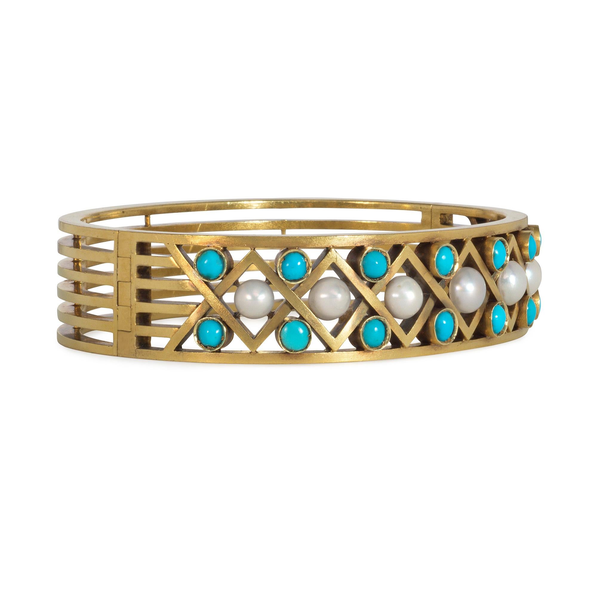 An antique gold cuff bracelet of openwork design with latticed front panel set with half pearls and turquoise cabochons, in 14k.  Russia.

Dimensions: 6 1/2
