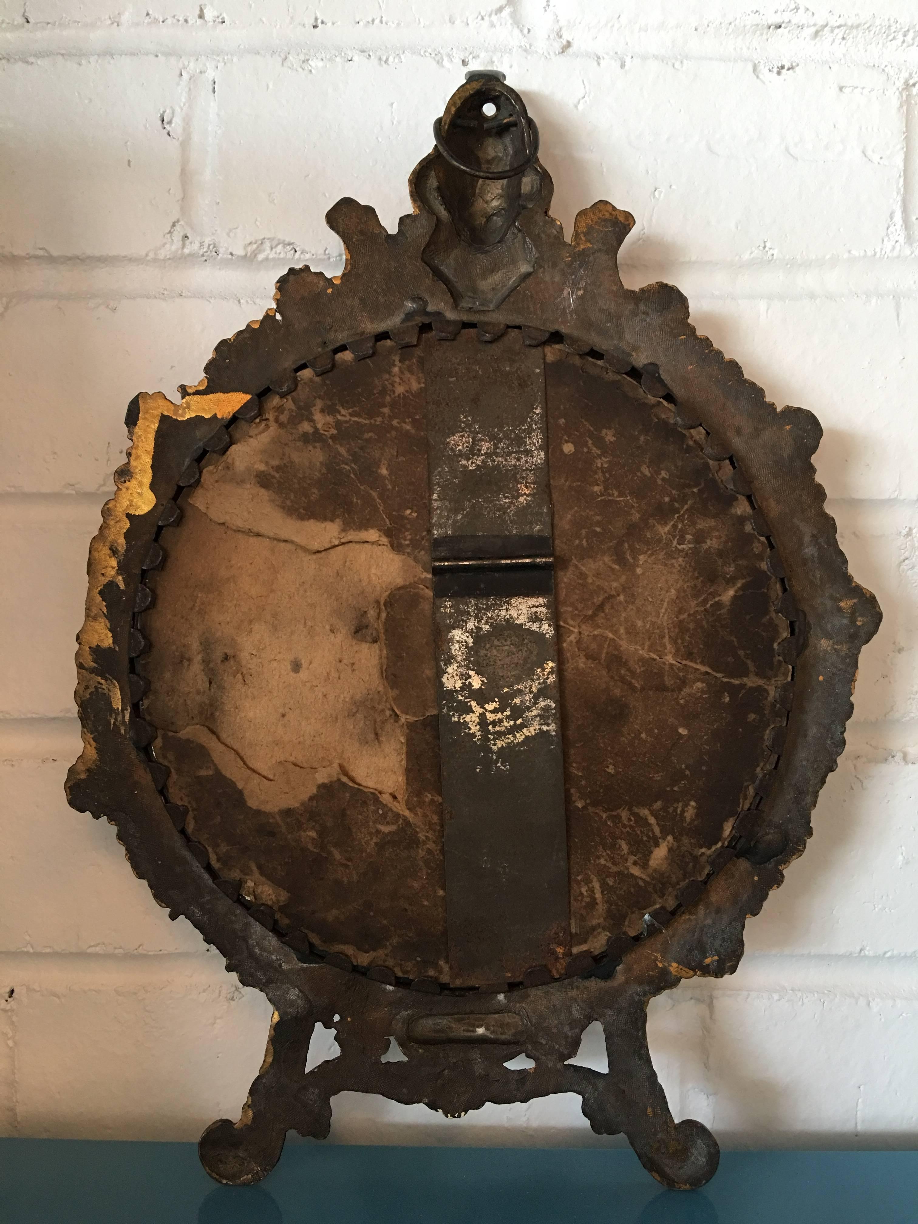 This lovely antique gold tabletop mirror is labelled 