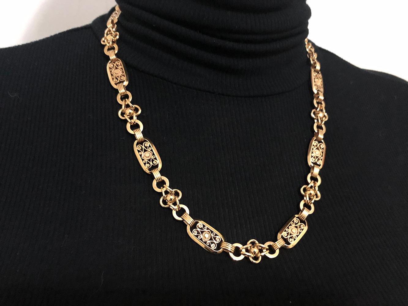 Beautiful antique watch chain.  Distinctive well-detailed open link.  Solid gauge 14K yellow gold.  20 1/2