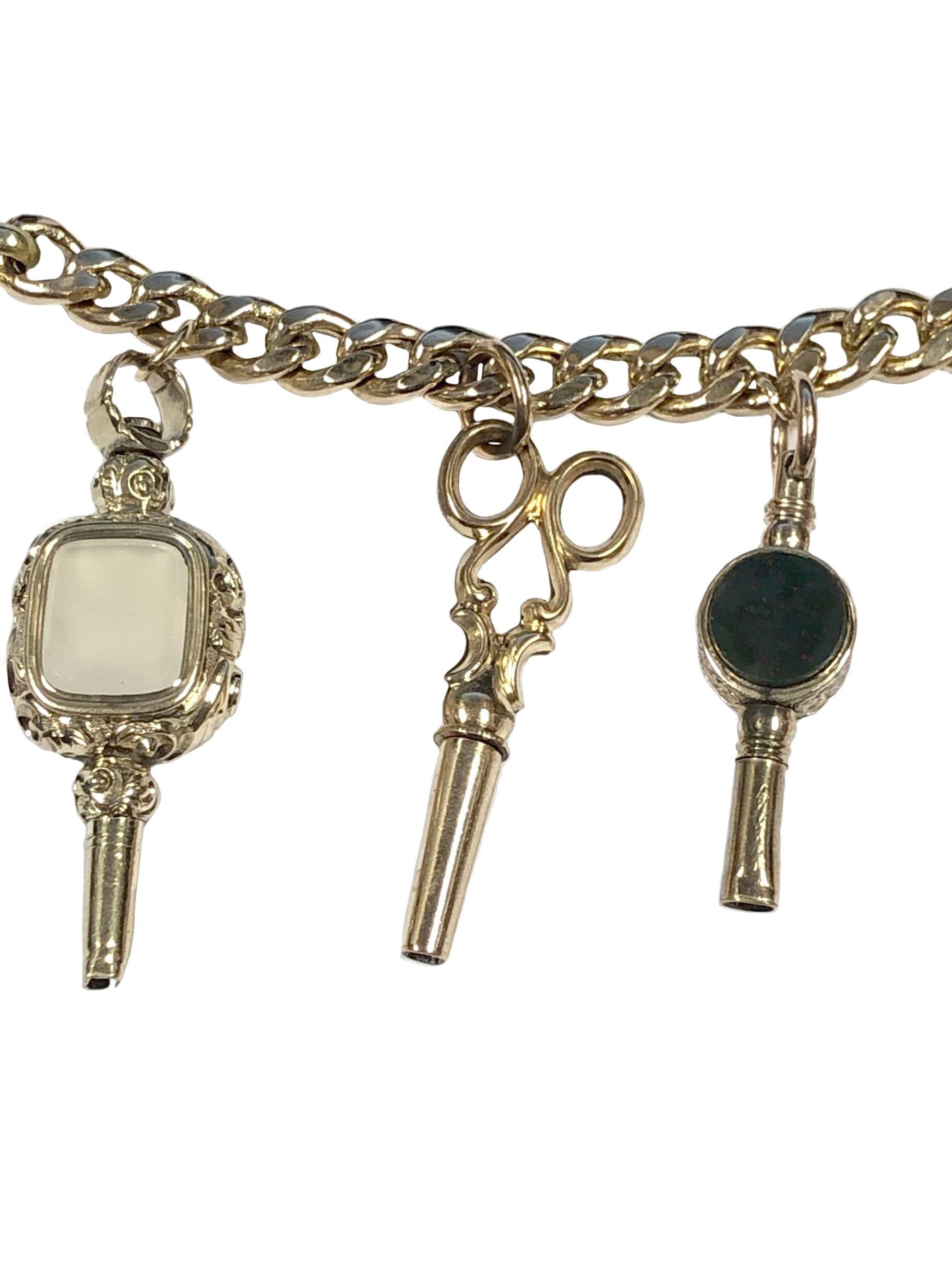 Circa 1800 to 1860s Mostly all Gold Watch Keys, attached from a 14k Yellow Gold Link Bracelet with an unusual Clutching Hand lock. some Keys set with Agate and other stones. Most of the Keys measure an average of 1 to 1 1/4 inch. Bracelet length 7