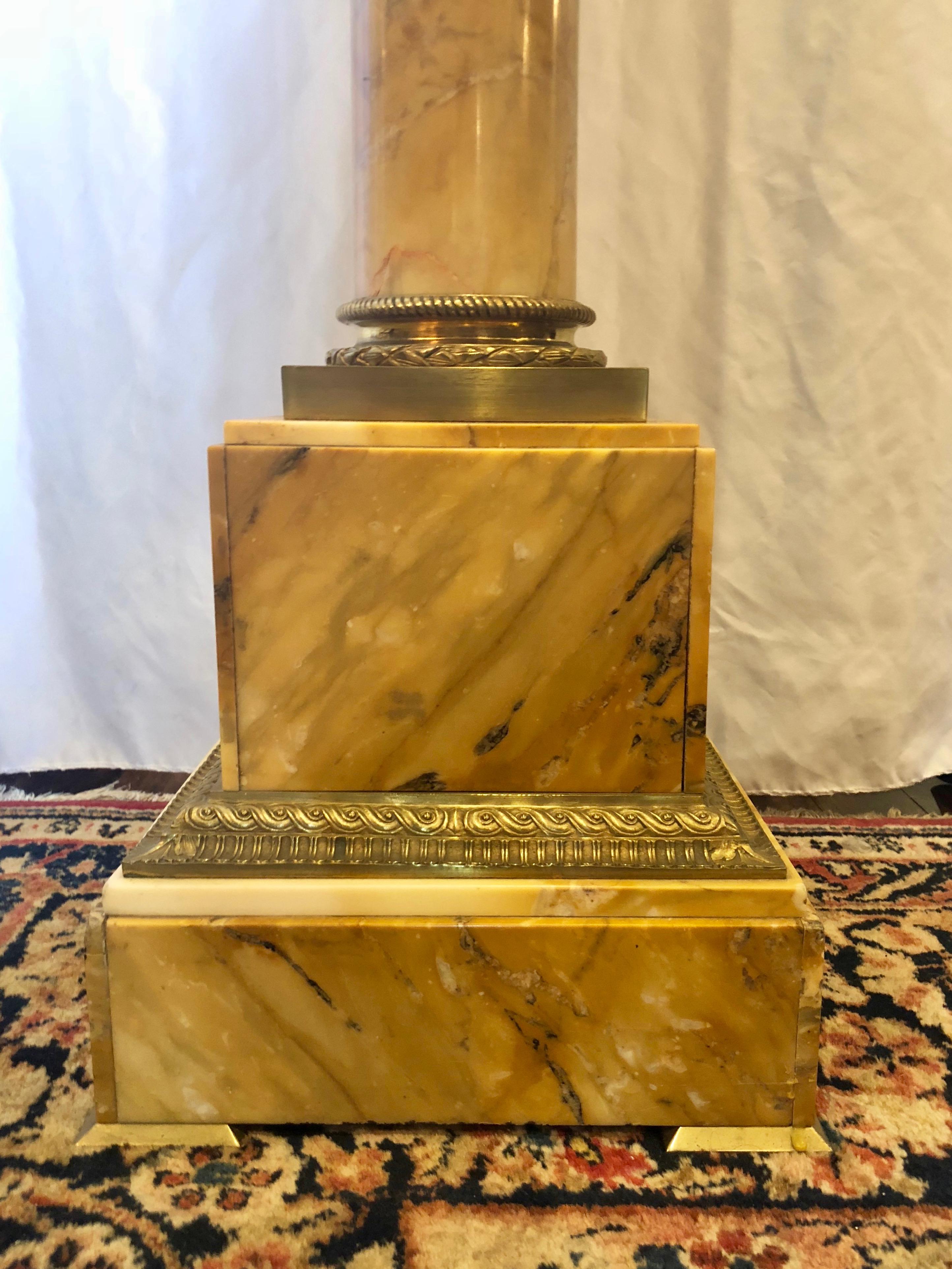 The lovely marble on this pedestal is very, very appealing.