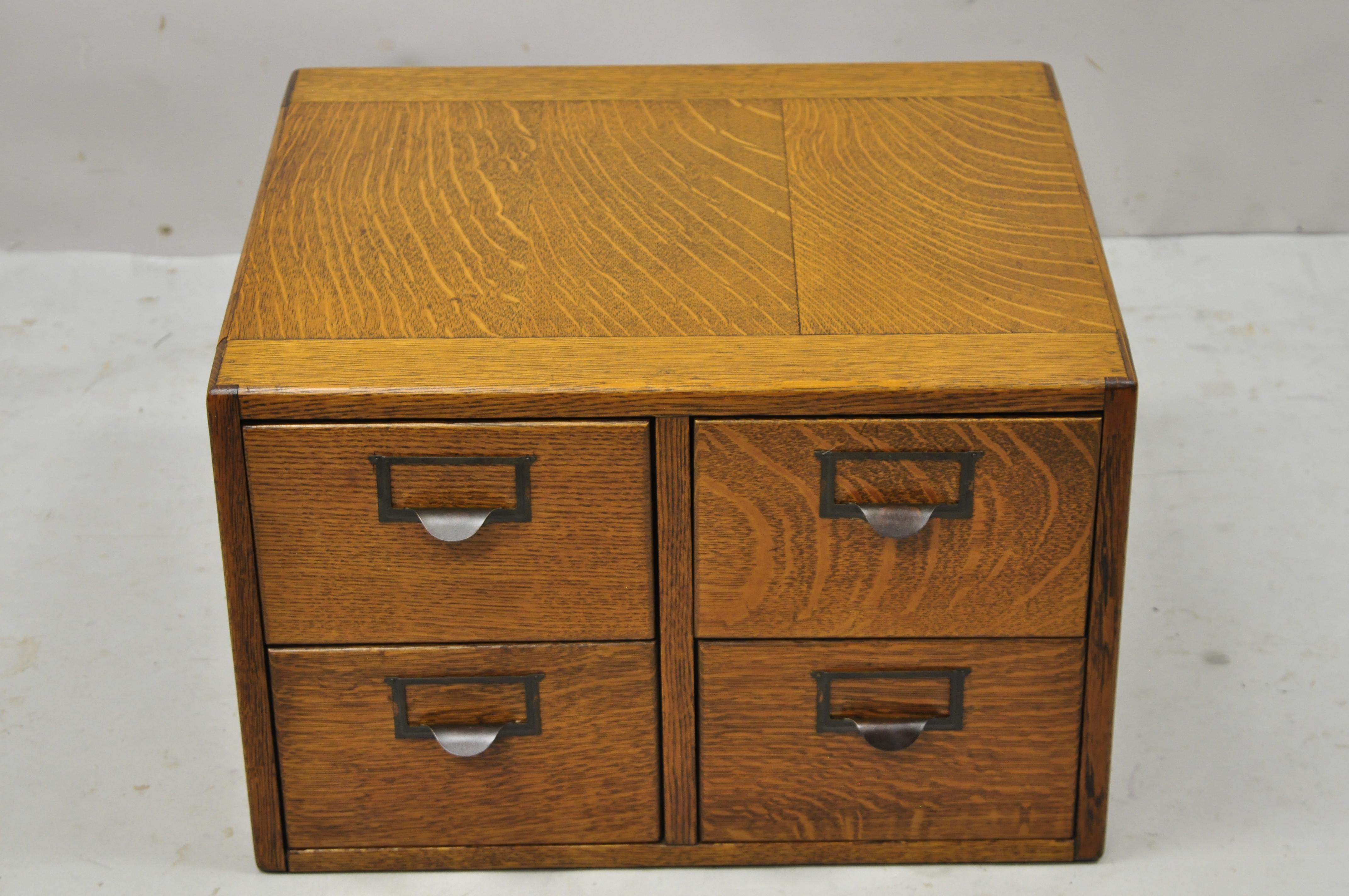 Antique golden mission tiger oak wood 4 drawer file card catalog cabinet. Item features solid wood construction, beautiful wood grain, 4 dovetailed drawers, very nice antique item, quality American craftsmanship, great style and form. Circa early
