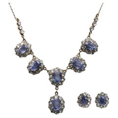 Antique golden set of necklace and earrings with blue and white sapphires