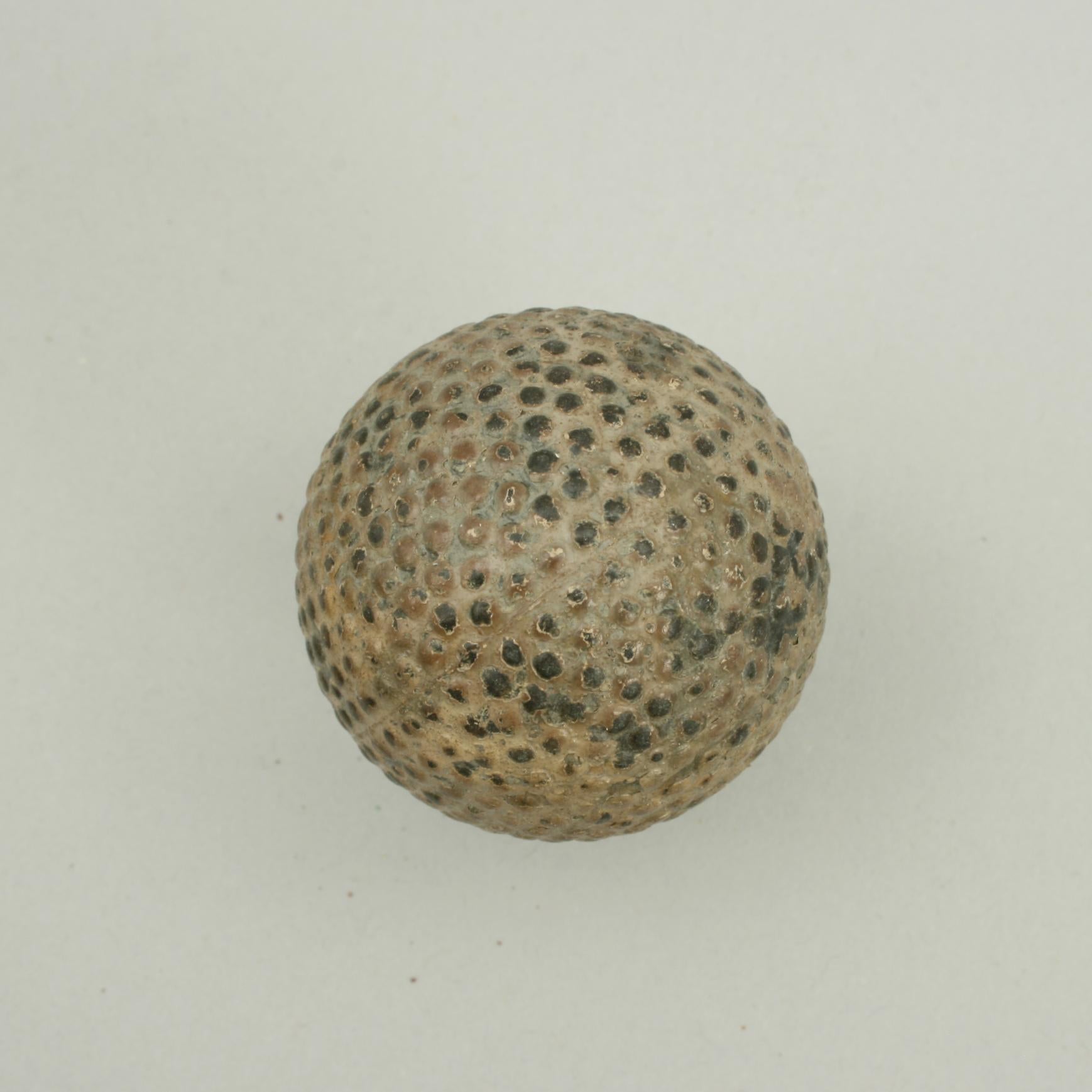 'The Kiddy' Bramble golf ball.
A bramble patterned rubber core golf ball made by Wood-Milne Ltd. The ball is marked on both poles 'The Kiddy' on one and 'Wood-Milne' on the other. This is a good classic bramble pattern, raised dimples, golf ball