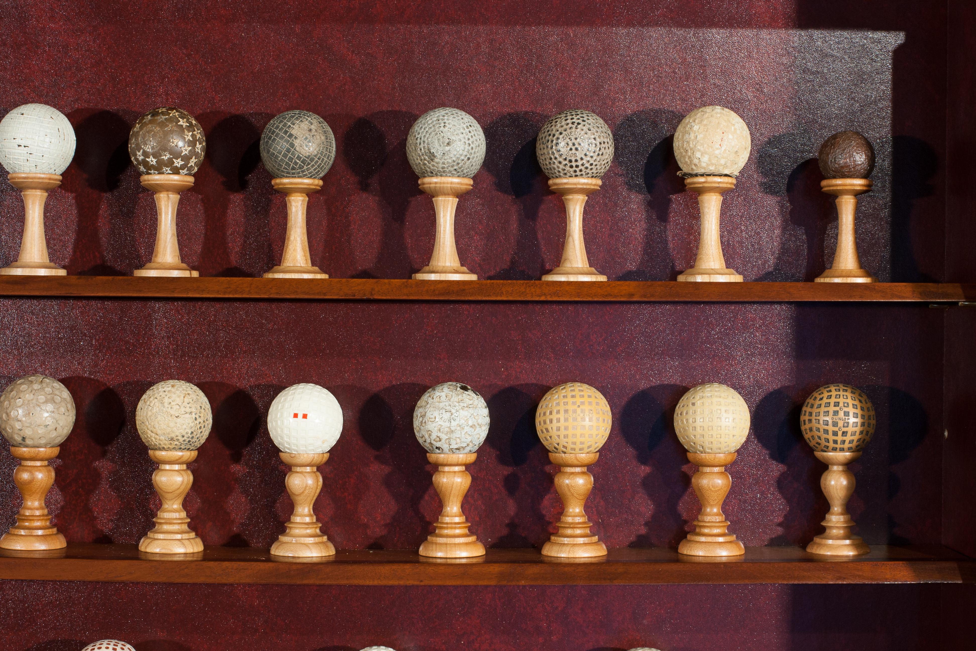 Antique Golf Ball Collection from 1890 - 1960 in Cabinet 1